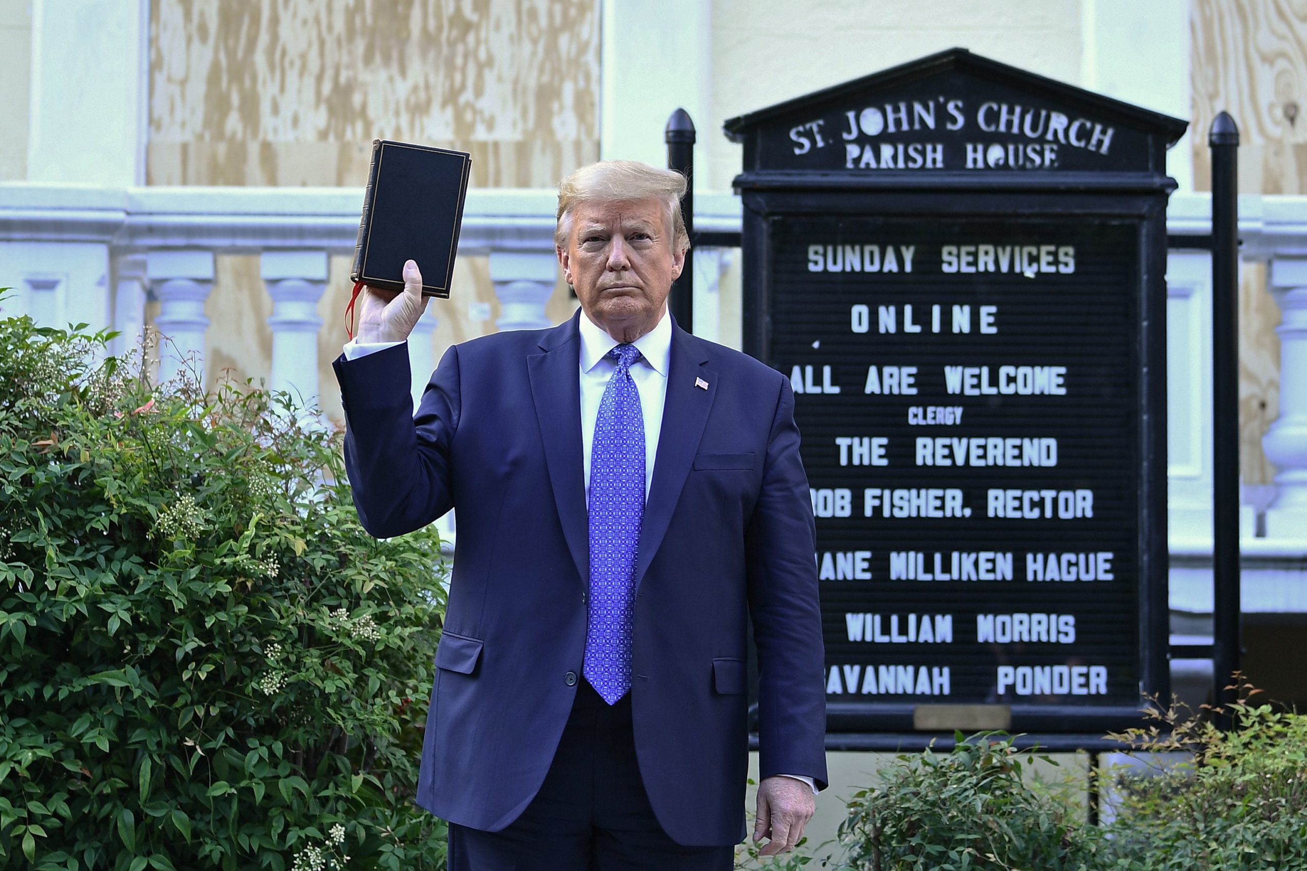 US President Donald Trump holds up a Bible outside of St John's Episcopal church across Lafayette Park in Washington, DC on June 1, 2020. - US President Donald Trump was due to make a televised address to the nation on Monday after days of anti-racism protests against police brutality that have erupted into violence. The White House announced that the president would make remarks imminently after he has been criticized for not publicly addressing in the crisis in recent days. (Photo by Brendan Smialowski / AFP) (Photo by BRENDAN SMIALOWSKI/AFP via Getty Images)