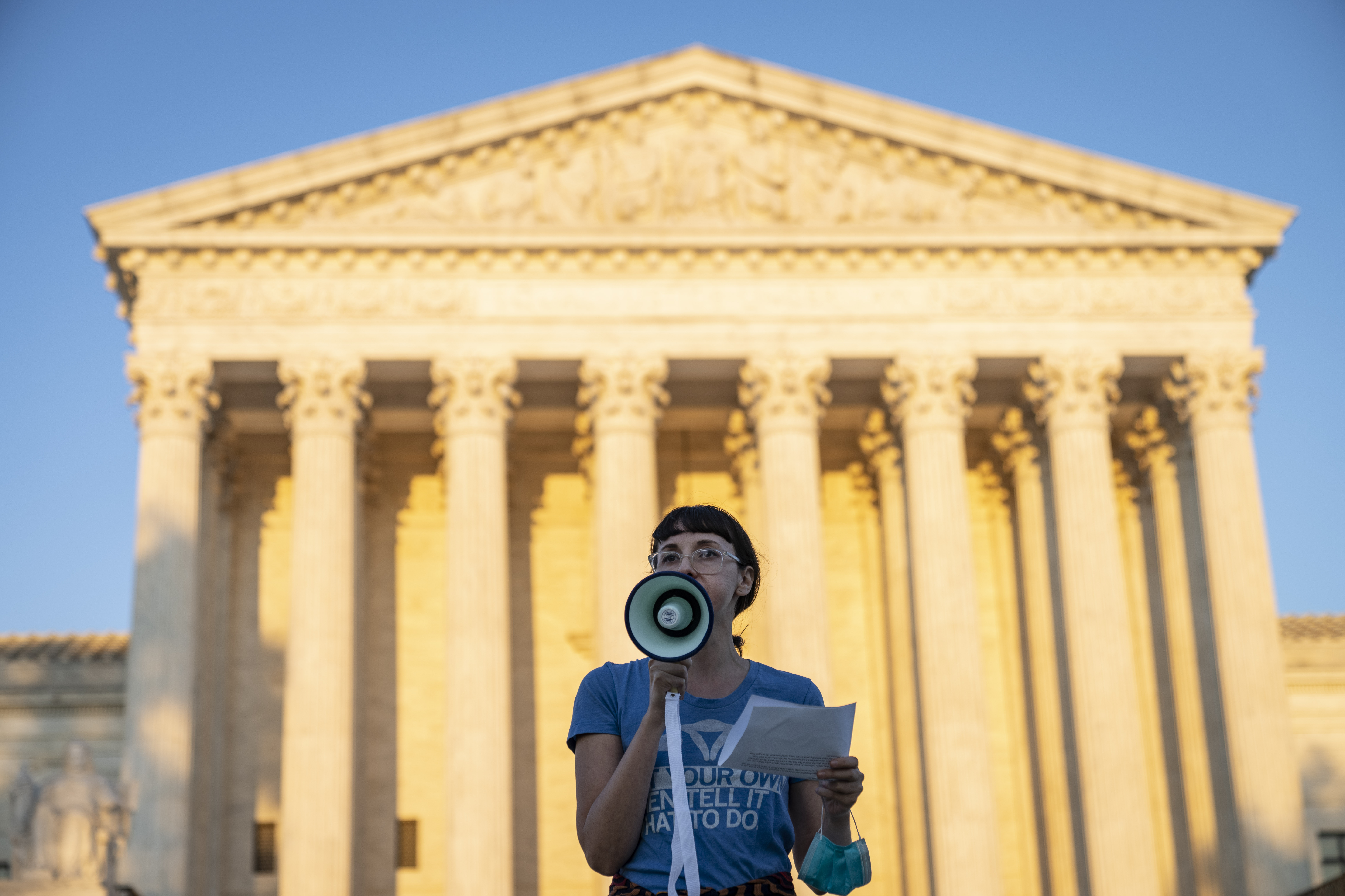 An activist protests a new Texas abortion law outside the Supreme Court. (Drew Angerer/Getty Images)