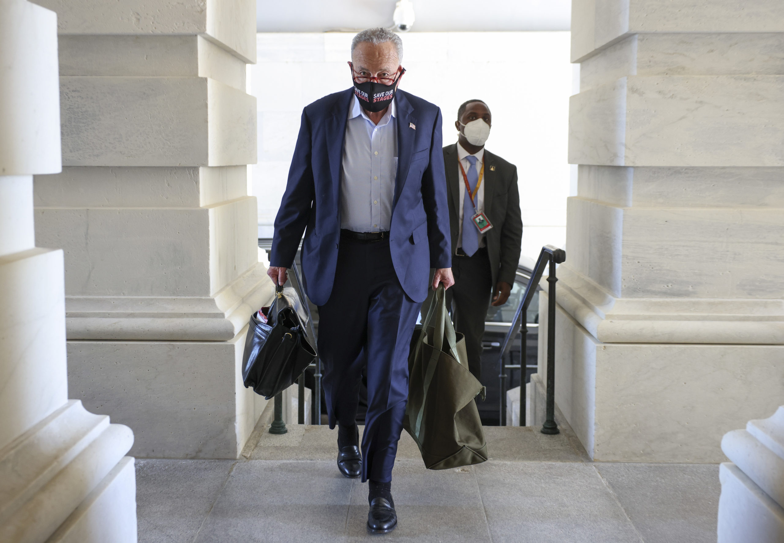 Senate Majority Leader Chuck Schumer arrives at the Capitol on Monday. He and House Speaker Nancy Pelosi are trying to guide a funding bill, budget and infrastructure package through a bitterly divided Congress before Friday, when a shutdown is set to go into effect. (Kevin Dietsch/Getty Images)
