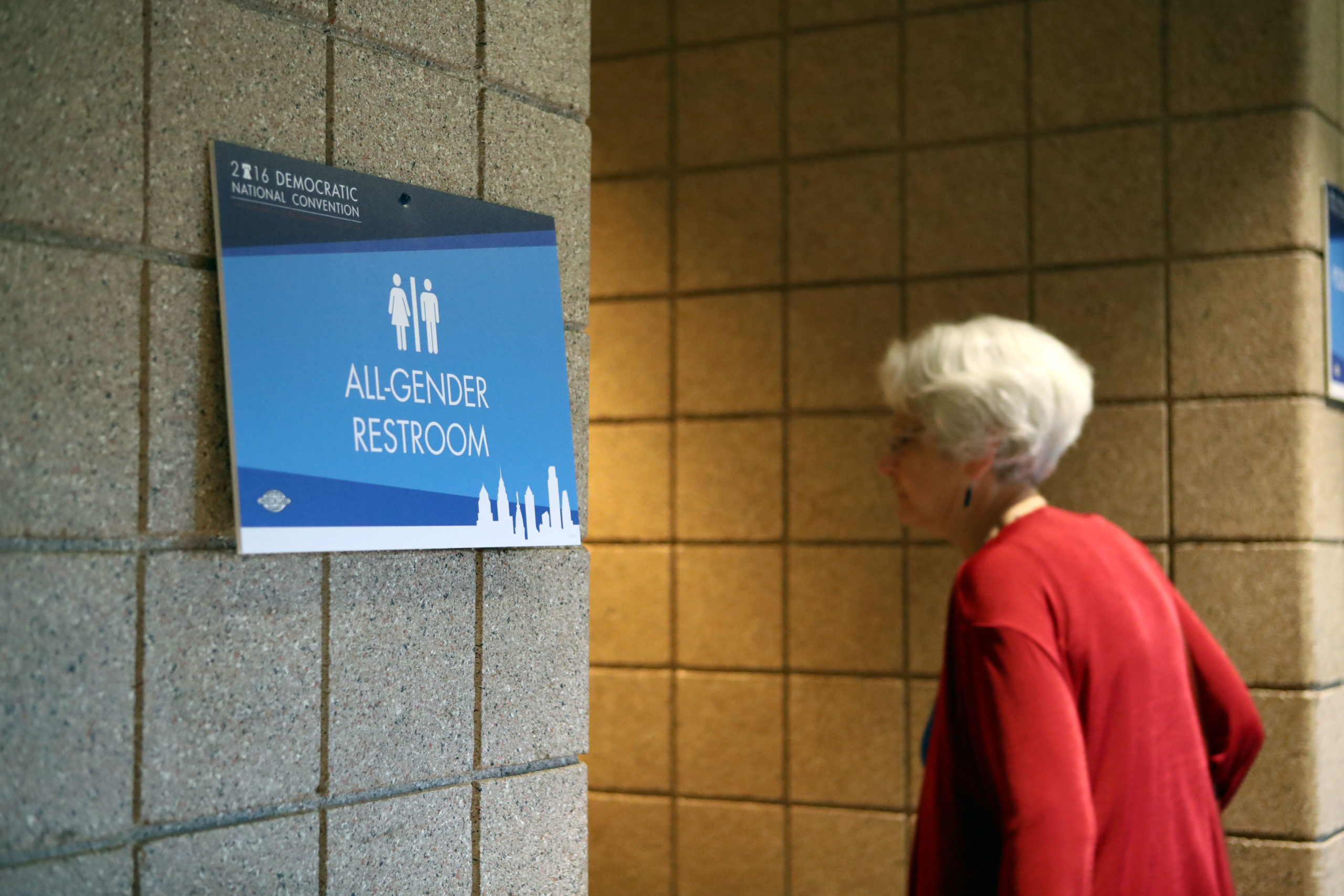 PHILADELPHIA, PA - JULY 26: A woman enters all gender public restroom at Wells Fargo Center before day two of the Democratic National Convention on July 26, 2016 in Philadelphia, Pennsylvania. Former President Bill Clinton will speak at the second day of Democratic Nation Convention. (Photo by Jessica Kourkounis/Getty Images)