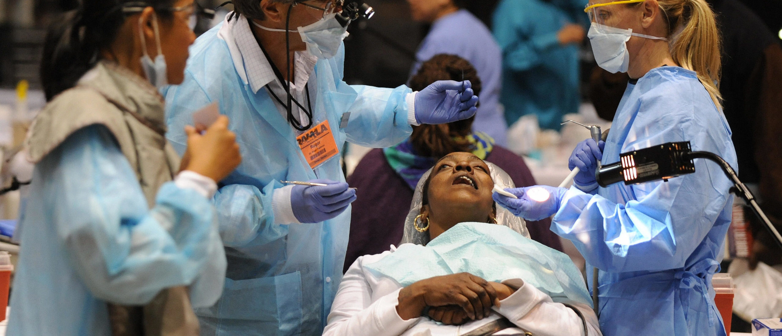 Volunteer medical staff offer free dental services to those without health insurance in Los Angeles. (Mark Ralston/AFP via Getty Images)