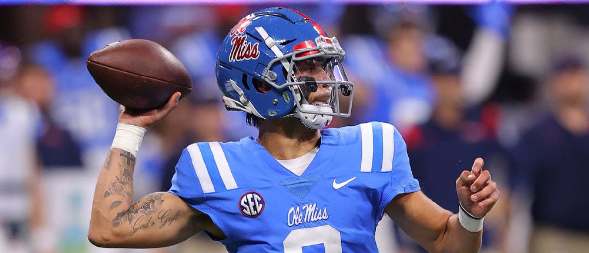 Ole Miss QB Matt Corral barrels over official on touchdown run