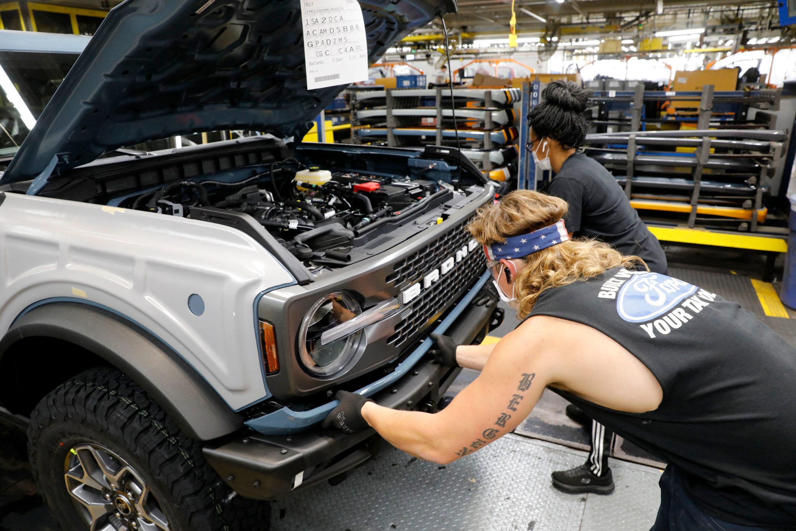 Line workers assemble Ford Motor Company's 2021 Ford Bronco on the line at their Michigan Assembly Plant in Wayne, Michigan on June 14, 2021. (Photo by JEFF KOWALSKY/AFP via Getty Images)