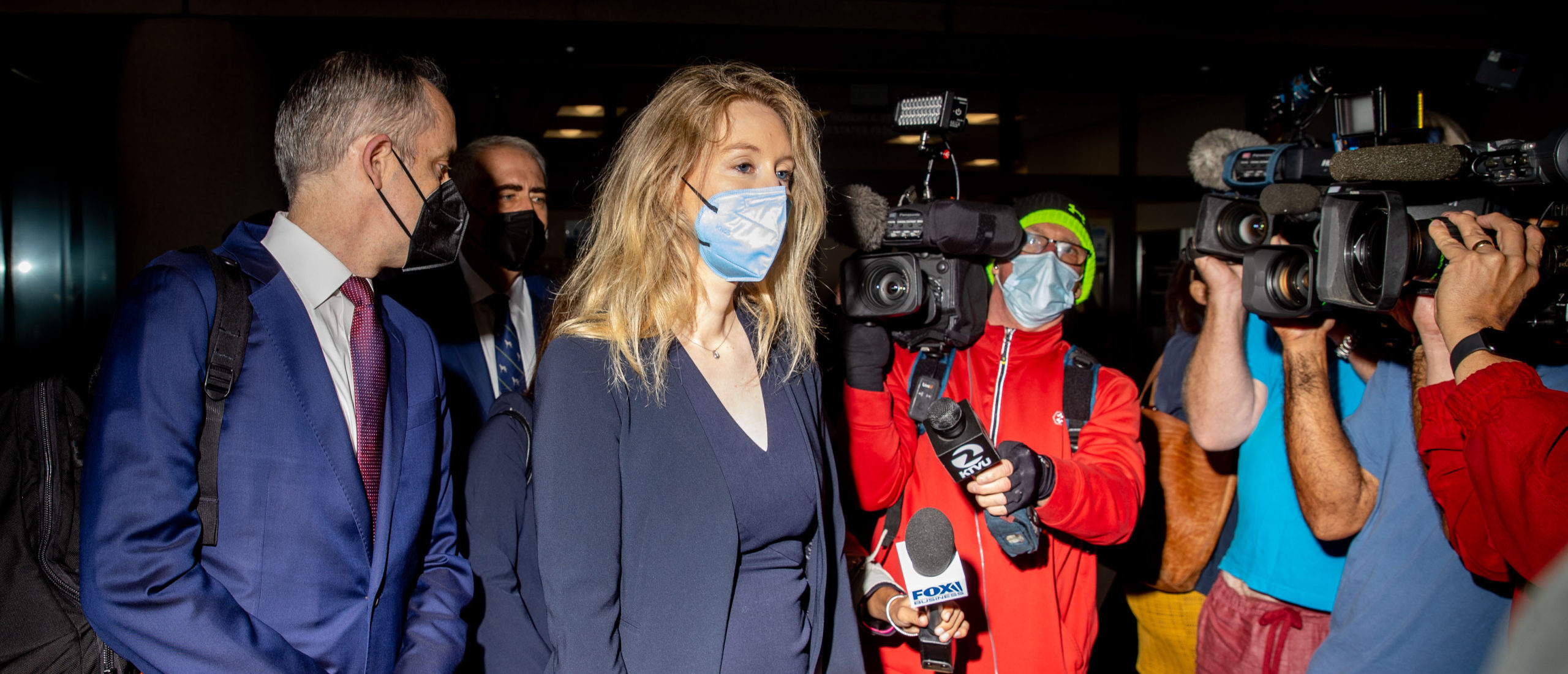 Theranos founder Elizabeth Holmes enters the Robert F. Peckham Federal Building with her defense team on August 31, 2021 in San Jose, California. (Photo by Ethan Swope/Getty Images)