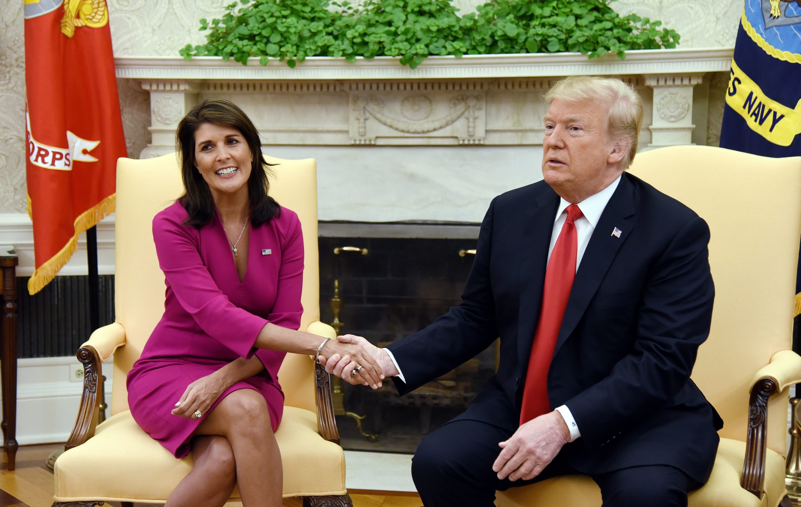 US President Donald Trump shakes hands with Nikki Haley, the United States Ambassador to the United Nations in the Oval office of the White House on October 9, 2018 in Washington, DC. (Photo by OLIVIER DOULIERY/AFP via Getty Images)