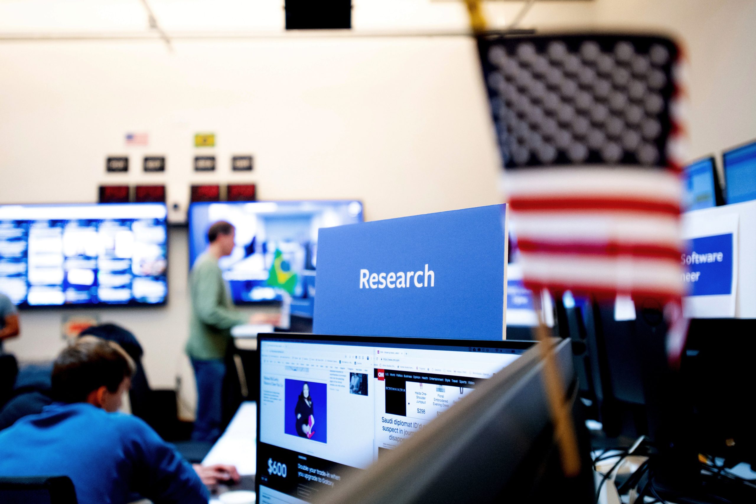 Employees work in Facebook's "War Room," during a media demonstration on October 17, 2018, in Menlo Park, California. - The freshly launched unit at Facebook's Menlo Park headquarters is the nerve center for the fight against misinformation and manipulation of the largest social network by foreign actors trying to influence elections in the United States and elsewhere. The war room, which will ramp up activity for the November 6 midterm US elections, is the most concrete sign of Facebook's efforts to weed out misinformation. (Photo by NOAH BERGER / AFP) (Photo by NOAH BERGER/AFP via Getty Images)