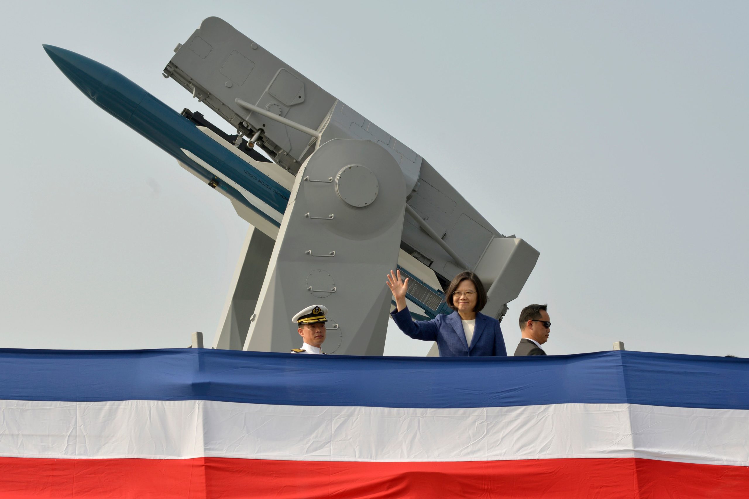 Taiwan's President Tsai Ing-wen (C) waves to assembled guests from the deck of the 'Ming Chuan' frigate during a ceremony to commission two Perry-class guided missile frigates from the US into the Taiwan Navy, in the southern port of Kaohsiung on November 8, 2018. (Photo by CHRIS STOWERS/AFP via Getty Images)