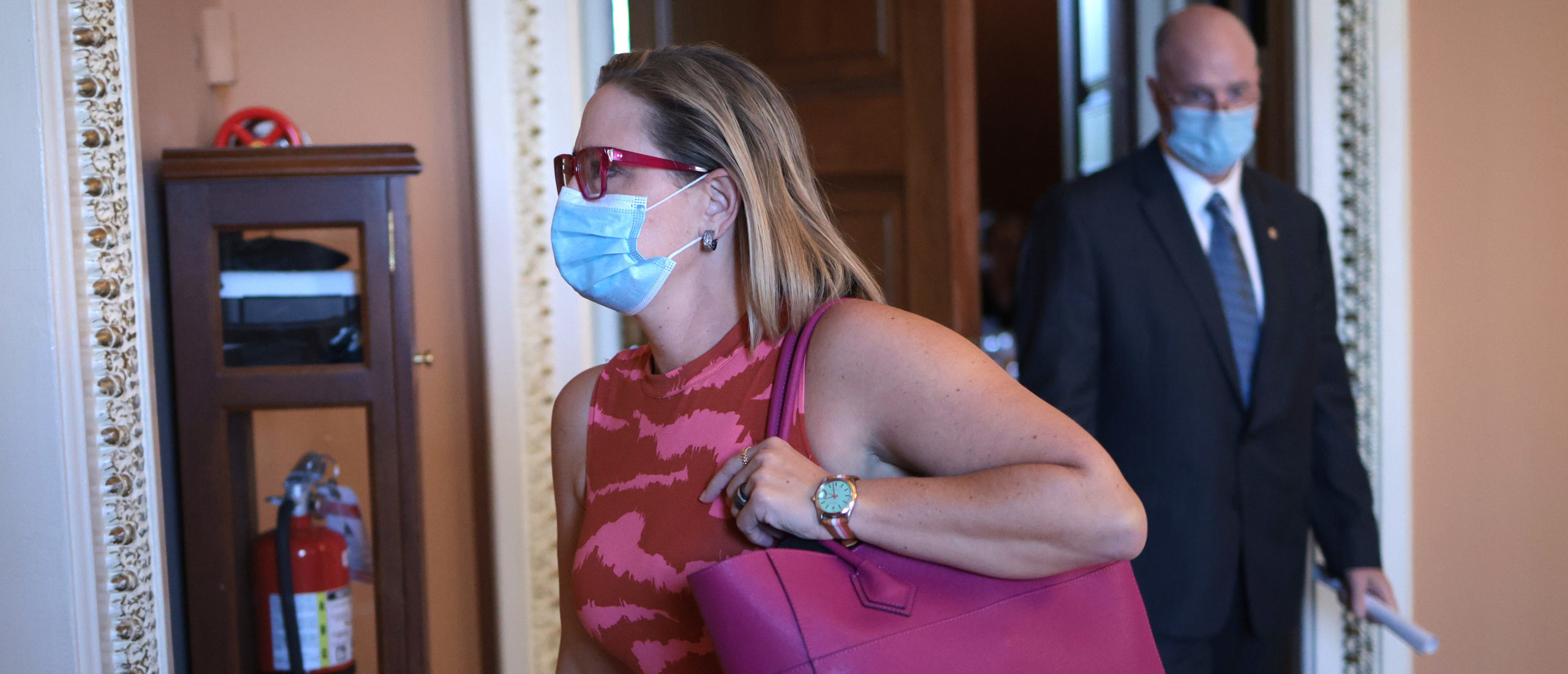 Sen. Kyrsten Sinema (D-AZ) leaves a Democratic luncheon before heading to the U.S. Senate chamber at the U.S. Capitol on September 30, 2021 in Washington, DC. The Senate is expected to pass a short term spending bill to avoid a government shutdown. (Photo by Win McNamee/Getty Images)