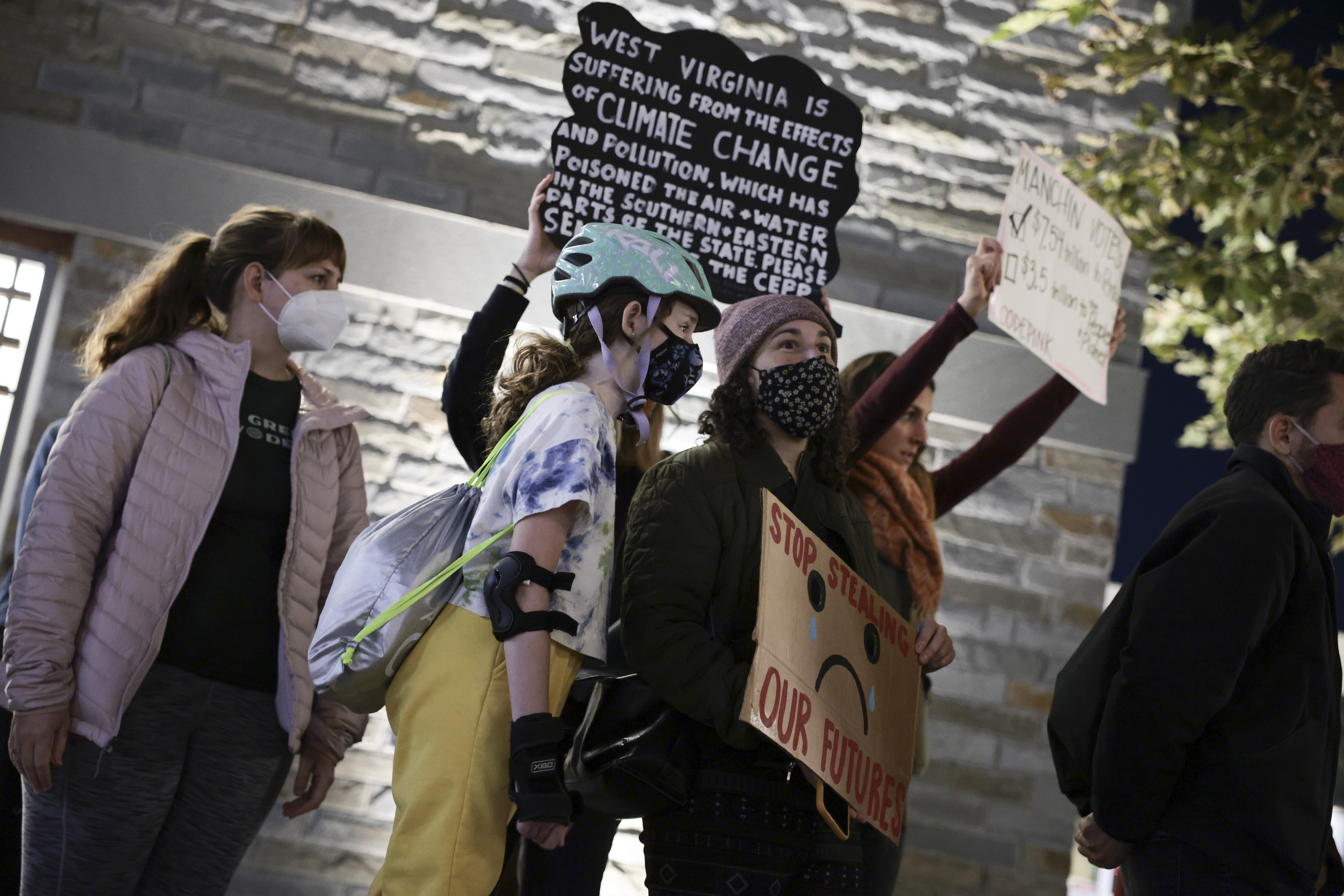 Climate activists protest near Sen. Joe Manchin’s yacht on Monday in Washington, D.C. (Anna Moneymaker/Getty Images)