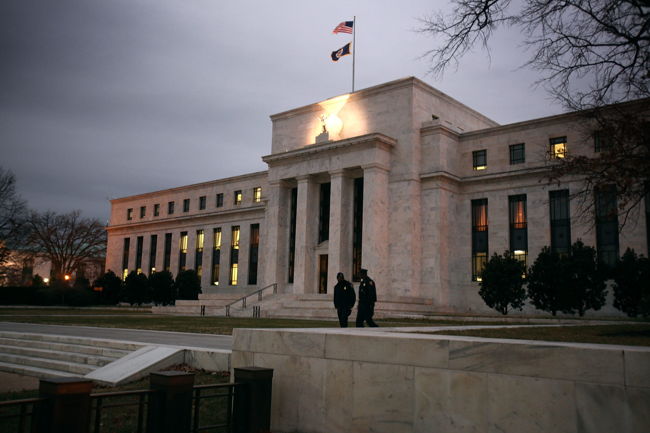 WASHINGTON - DECEMBER 16: Flags fly over the Federal Reserve Building on December 16, 2008 in Washington, D.C. The Fed began its last meeting of 2008 today, where it is expected to announced another reduction in the key interest rate, amongst other measures meant to stimulate the economy. (Photo by Mark Wilson/Getty Images)