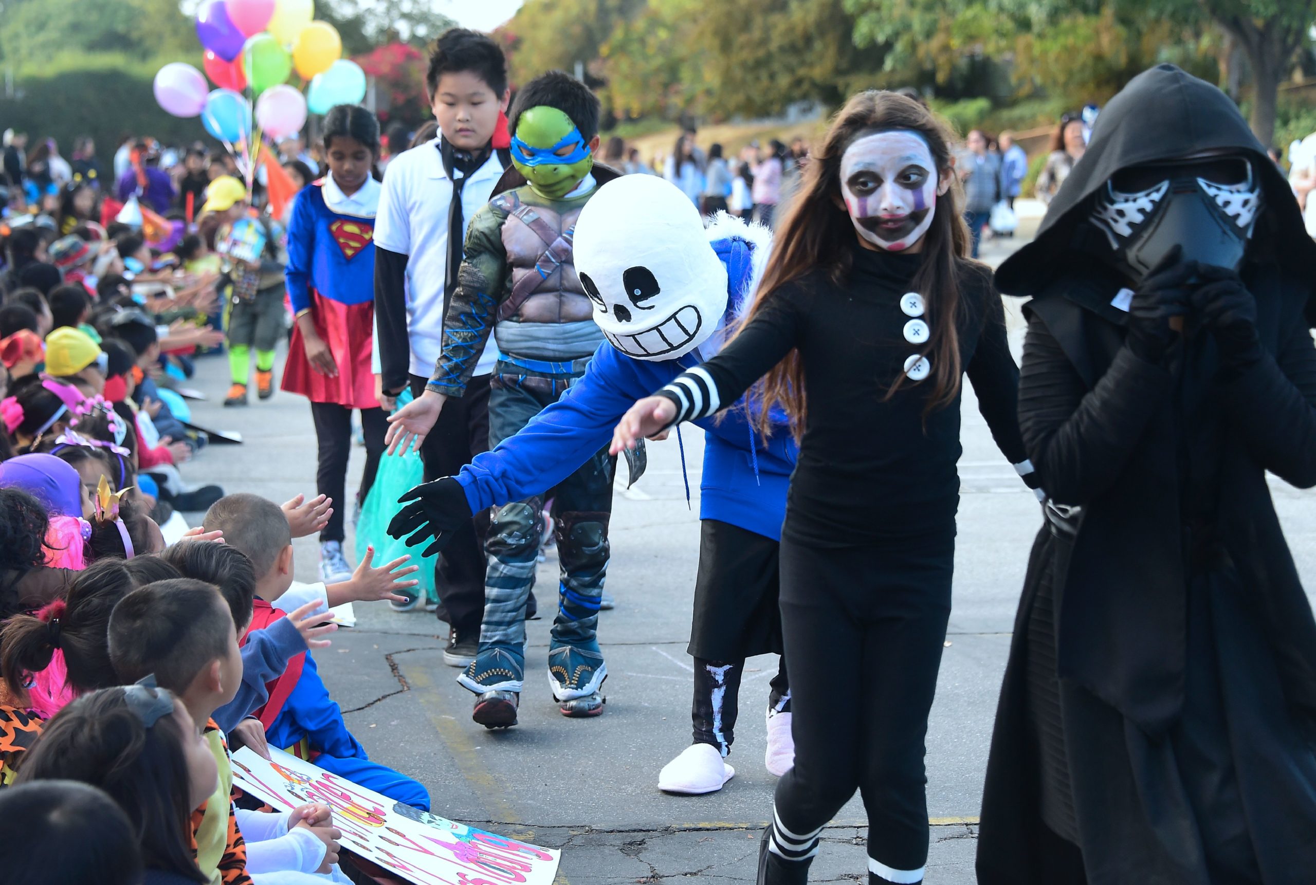 Schoolchildren take part in a morning Halloween parade dressed in their costumes to celebrate Halloween on October 31, 2016 in Monterey Park, California. (Photo by FREDERIC J. BROWN/AFP via Getty Images)