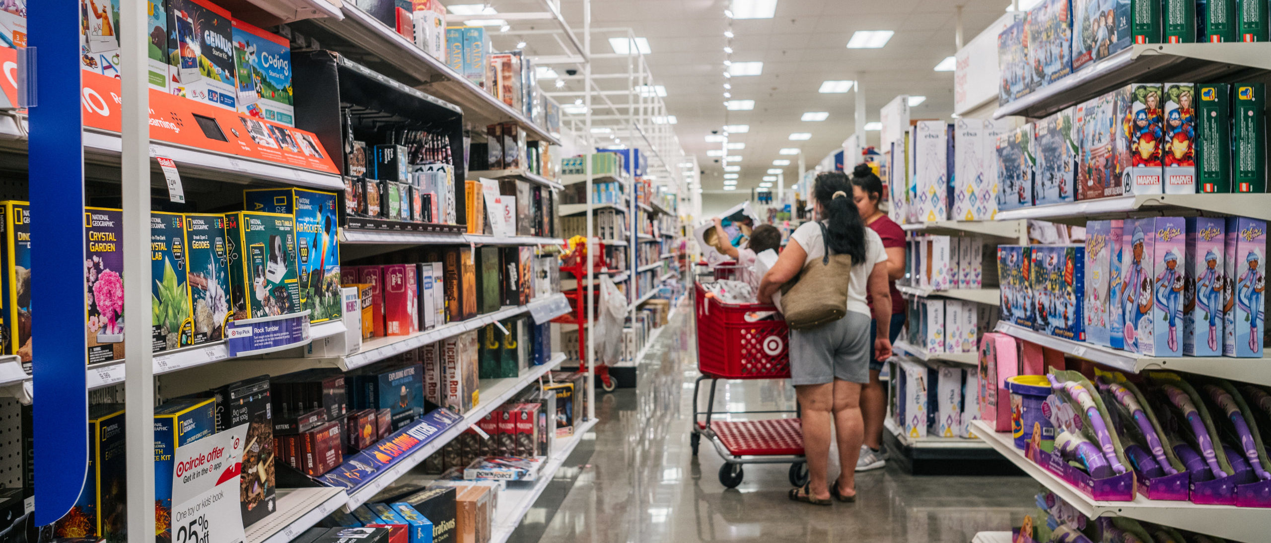 HOUSTON, TEXAS - OCTOBER 25: A family shops for toys at a Target store on October 25, 2021 in Houston, Texas. (Photo by Brandon Bell/Getty Images)