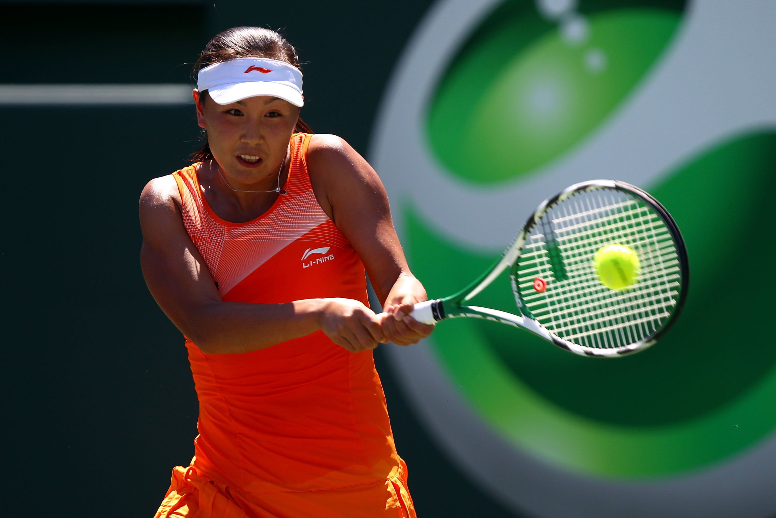Peng Shuai of China hits a backhand return against Svetlana Kuznetsova of Russia during the Sony Ericsson Open at Crandon Park Tennis Center on March 26, 2011 in Key Biscayne, Florida. (Photo by Clive Brunskill/Getty Images)