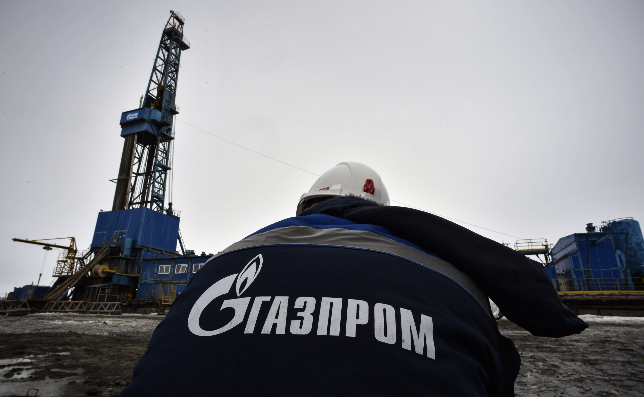 A worker walks towards a Gazprom gas drilling rig in the Arctic circle on May 21, 2019. (Alexander Nemenov/AFP via Getty Images)