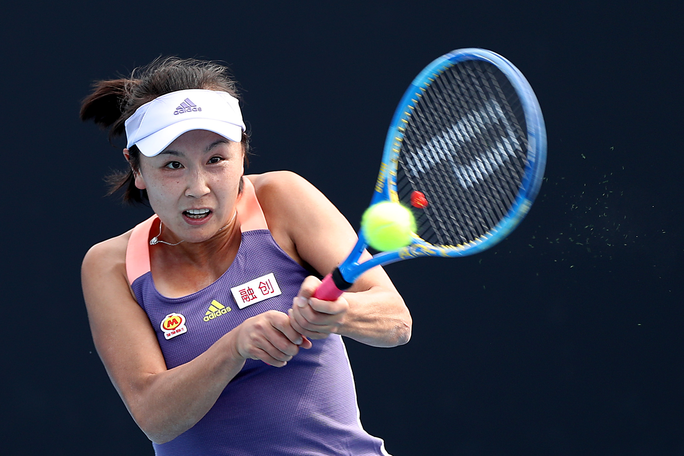 MELBOURNE, AUSTRALIA - JANUARY 21: Shuai Peng of China hits a backhand during her Women's Singles first round match against Nao Hibino of Japan on day two of the 2020 Australian Open at Melbourne Park on January 21, 2020 in Melbourne, Australia. (Photo by Mark Kolbe/Getty Images)