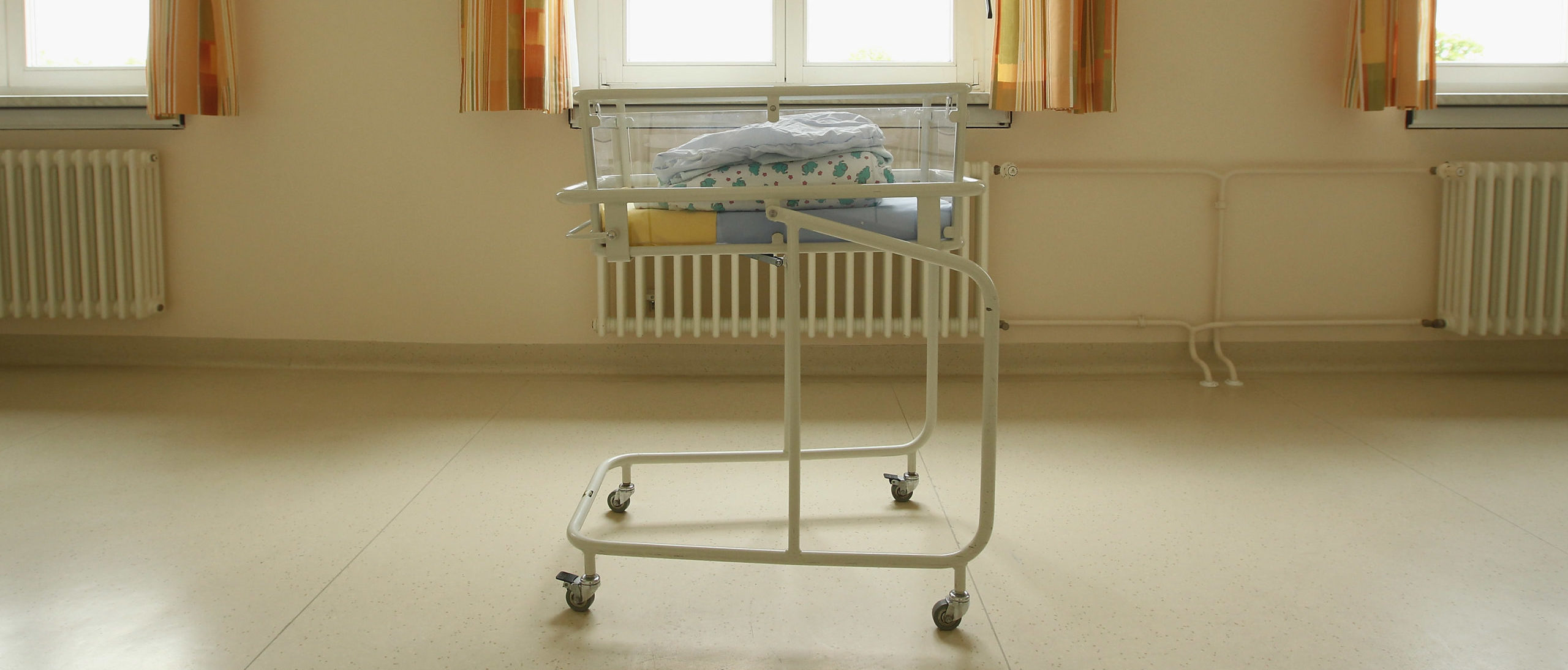 UNDISCLOSED, GERMANY - AUGUST 12: An empty baby bed, which has been placed under a window by the photographer, stands in the maternity ward of a hospital (a spokesperson for the hospital asked that the hospital not be named) on August 12, 2011 in a city in the east German state of Brandenburg, Germany.
