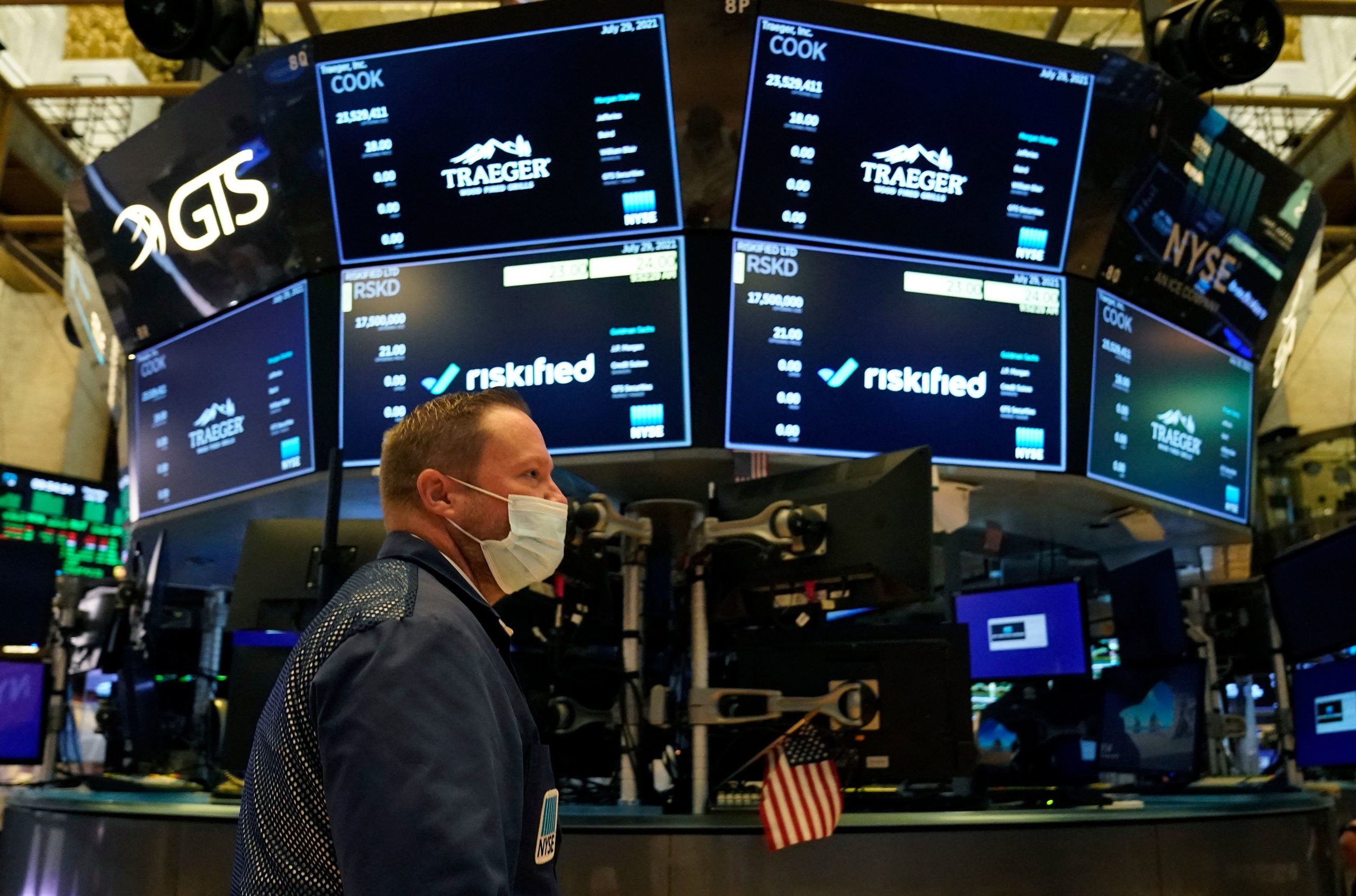Traders work on the floor at the New York Stock Exchange in New York, in July. (Timothy A. Clary/AFP via Getty Images)