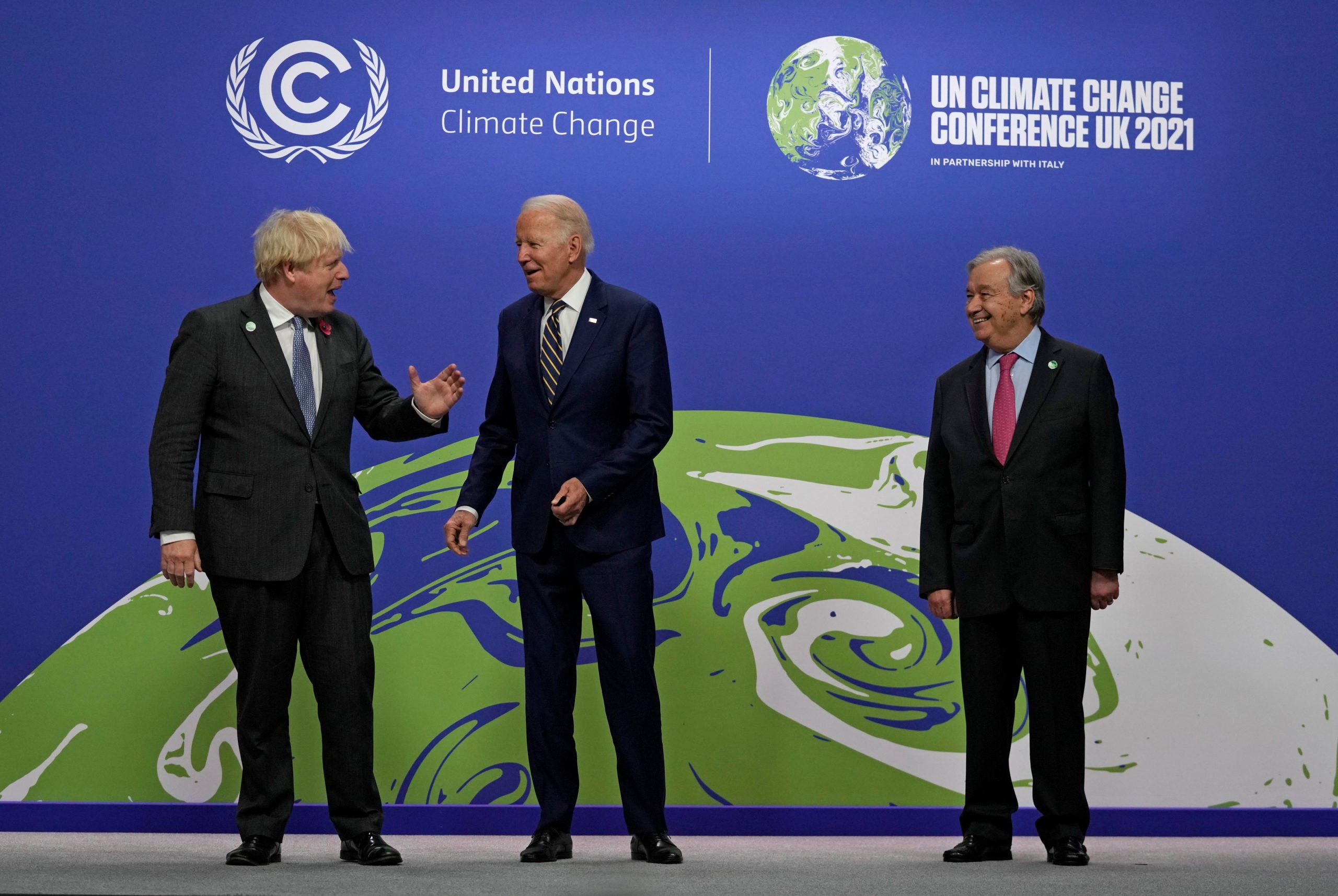 GLASGOW, SCOTLAND - NOVEMBER 01: British Prime Minister Boris Johnson (L) and UN Secretary-General Antonio Guterres (R) greet U.S. President Joe Biden as he arrives for day two of COP26 at SECC on November 1, 2021 in Glasgow, Scotland. 2021 sees the 26th United Nations Climate Change Conference. The conference will run from 31 October for two weeks, finishing on 12 November. It was meant to take place in 2020 but was delayed due to the Covid-19 pandemic. (Photo by Alastair Grant - Pool/Getty Images)