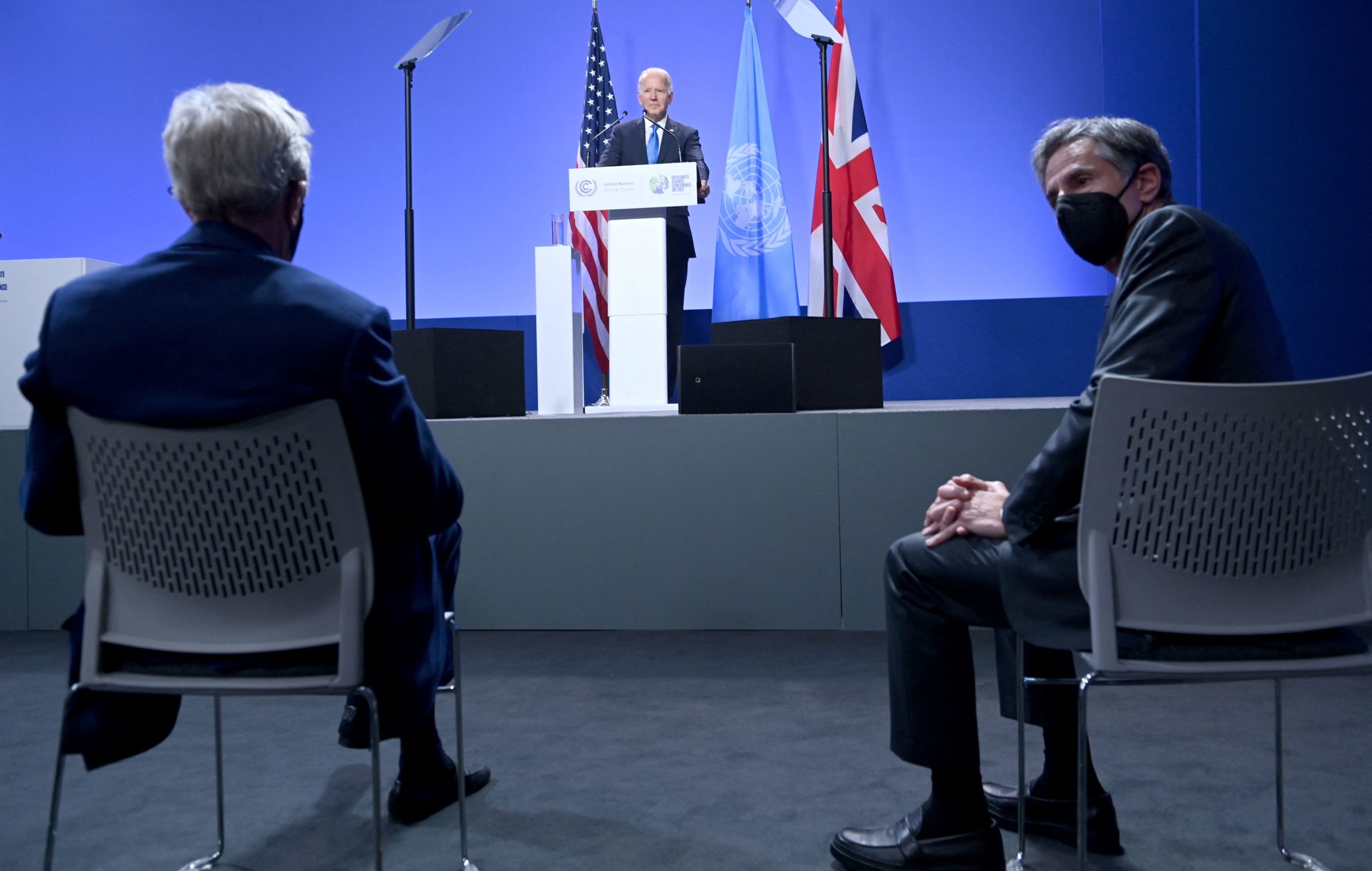President Joe Biden addresses a press conference as Secretary of State Antony Blinken U.S. Special Presidential Envoy for Climate John Kerry listen during the recent COP26 Climate Change Conference in Scotland on Nov. 2. (Brendan Smialowski/AFP via Getty Images)