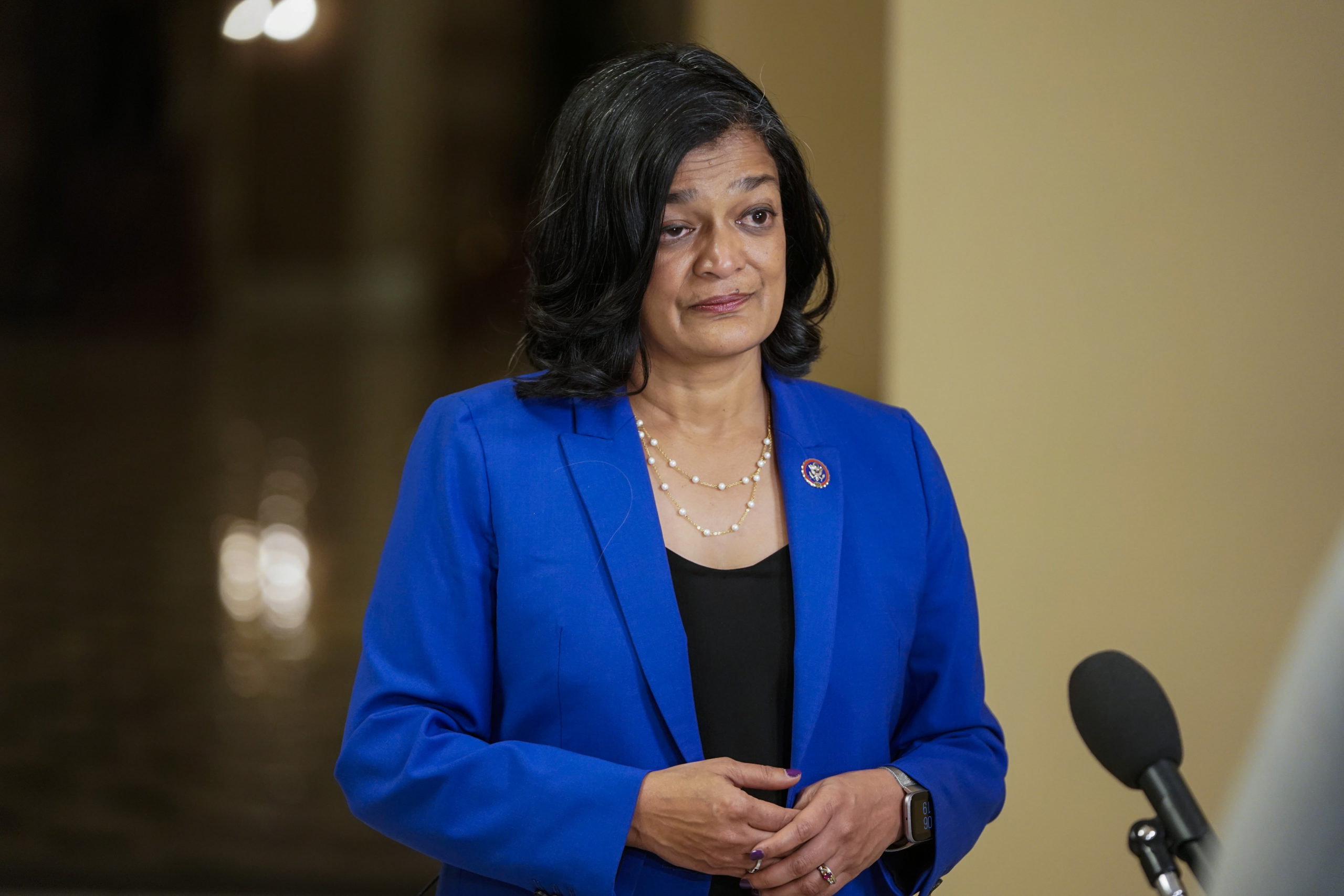 Rep. Pramila Jayapal gives an interview Thursday. Her caucus has repeatedly blocked the infrastructure bill from passing the House without the budget doing so as well. (Joshua Roberts/Getty Images)