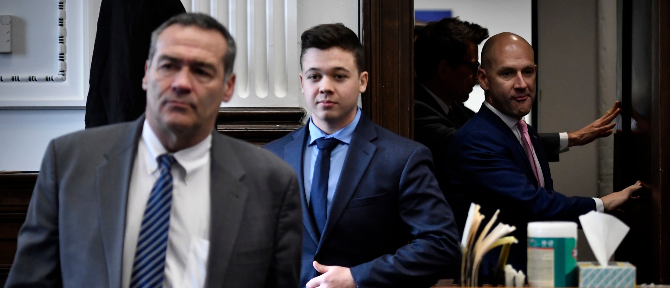 Kyle Rittenhouse, center, enters the courtroom with his attorneys Mark Richards, left, and Corey Chirafisi for a meeting called by Judge Bruce Schroeder at the Kenosha County Courthouse on November 18, 2021 in Kenosha, Wisconsin.(Photo by Sean Krajacic - Pool/Getty Images)