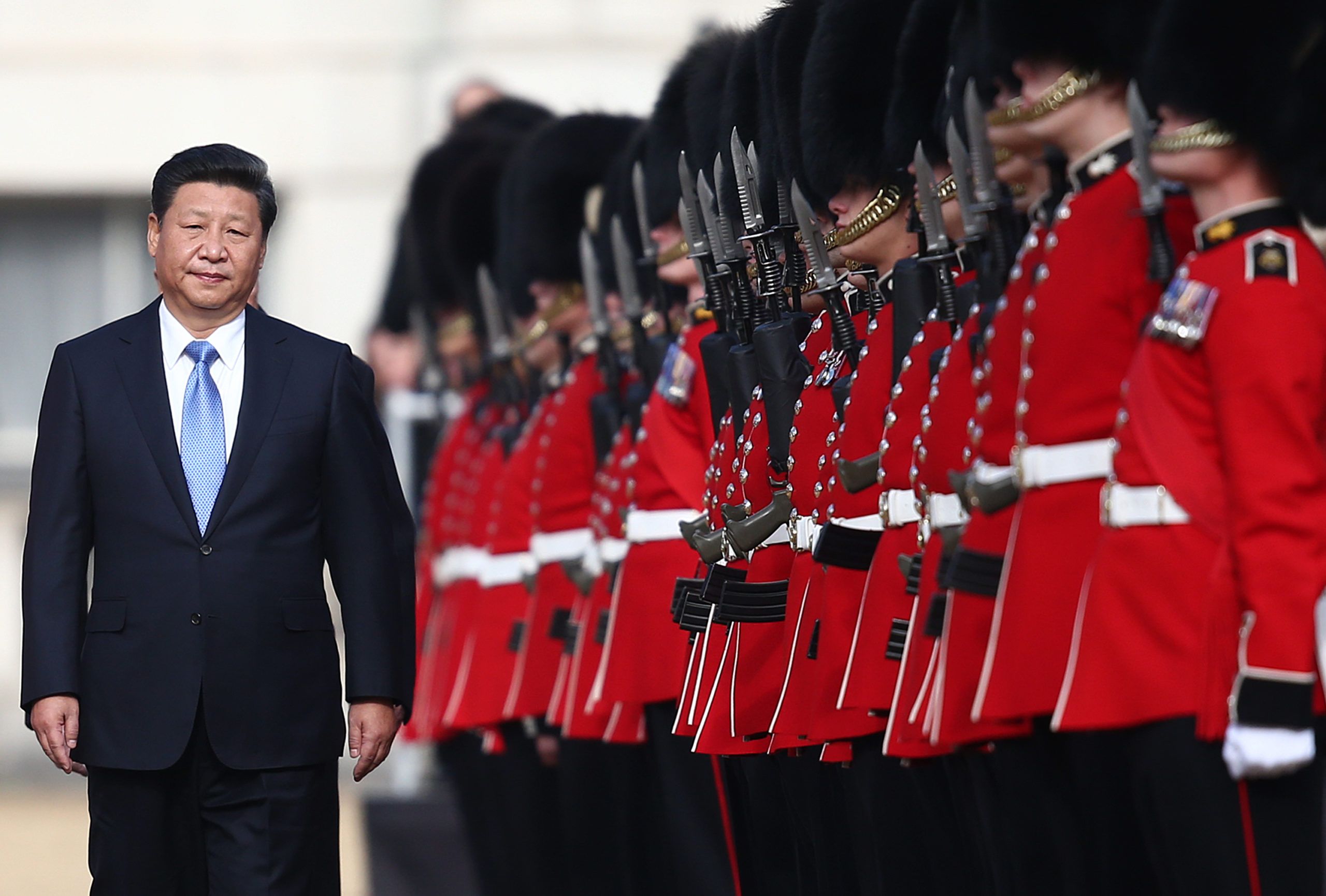 China's President, Xi Jinping, accompanied by Prince Philip (behind, not pictured) reviews an honour guard on October 20, 2015 in London, England. (Photo by Carl Court/Getty Images)