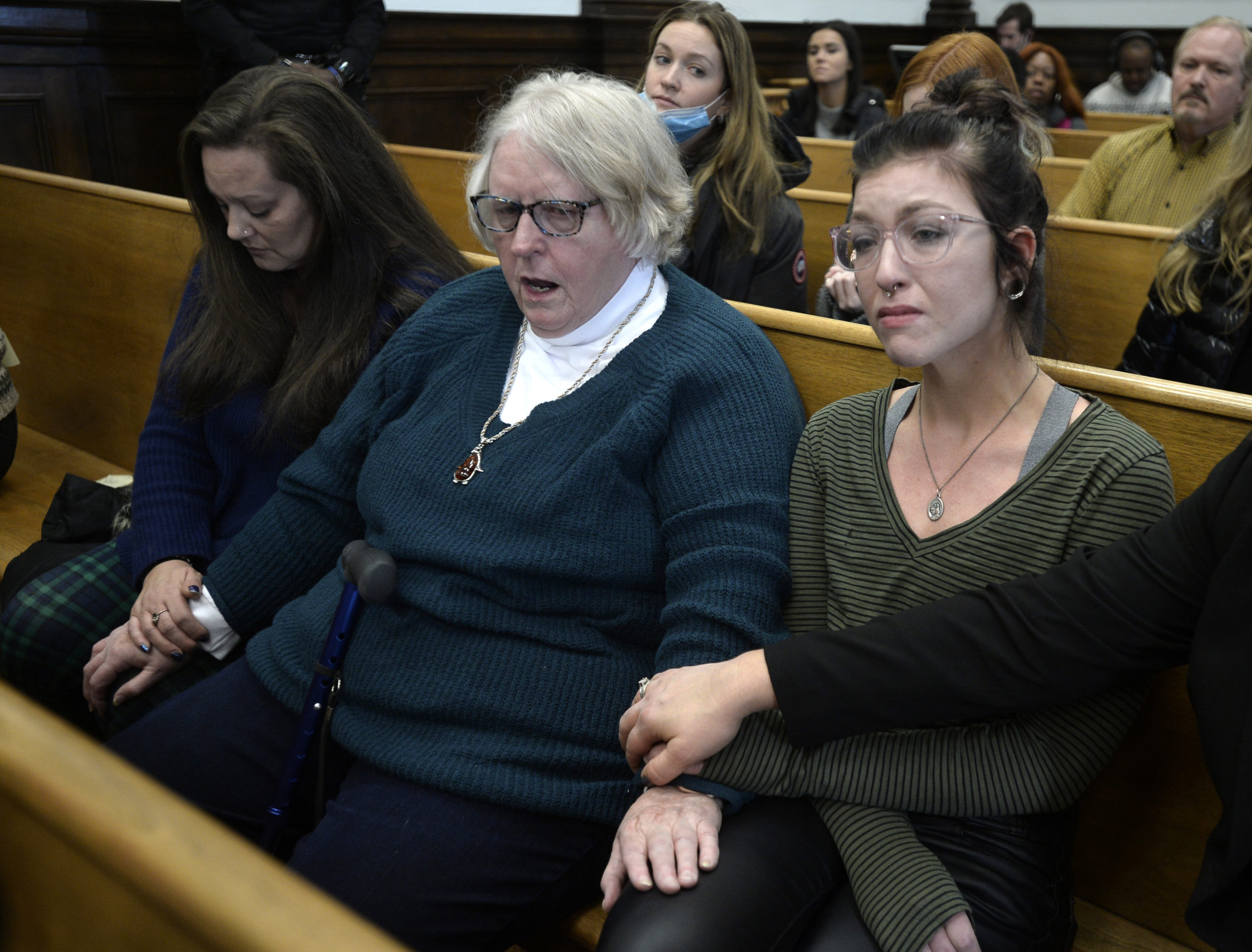 From left, Kariann Swart, Joseph Rosenbaum's fiancee, Susan Hughes, Anthony Huber's great aunt, and Hannah Gittings, Anthony Huber's girlfriend, listen as Kyle Rittenhouse is found not guilty at the Kenosha County Courthouse on November 19, 2021 in Kenosha, Wisconsin. (Sean Krajacic - Pool/Getty Images)