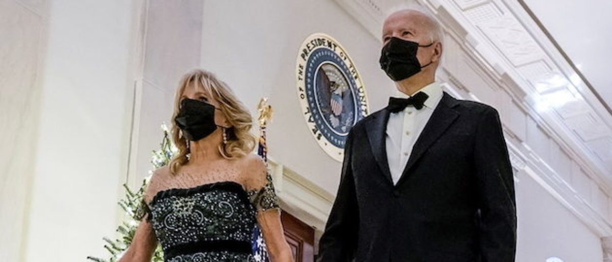 President Joe Biden, right, and First Lady Jill Biden, left, walk to host the 44th Kennedy Center Honorees at a reception in the East Room of the White House in Washington, U.S, December 5, 2021. REUTERS/Ken Cedeno