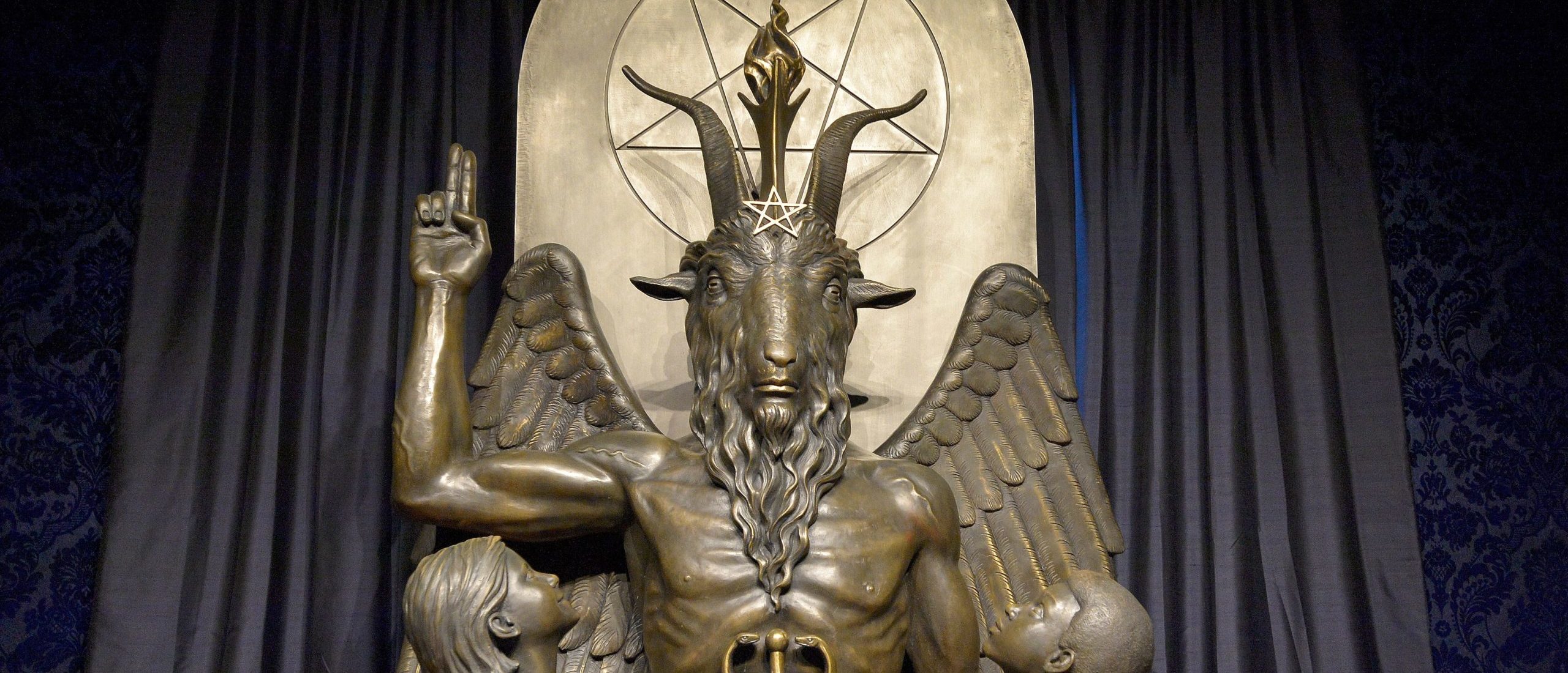 The Baphomet statue is seen in the conversion room at the Satanic Temple where a "Hell House" is being held in Salem, Massachusett on October 8, 2019. - The Hell House was a parody on a Christian Conversion centre meant to scare atheist and other Satanic Church members. (Photo by Joseph Prezioso / AFP) (Photo by JOSEPH PREZIOSO/AFP via Getty Images) Note: The display in the image above is not the display mentioned in the story.