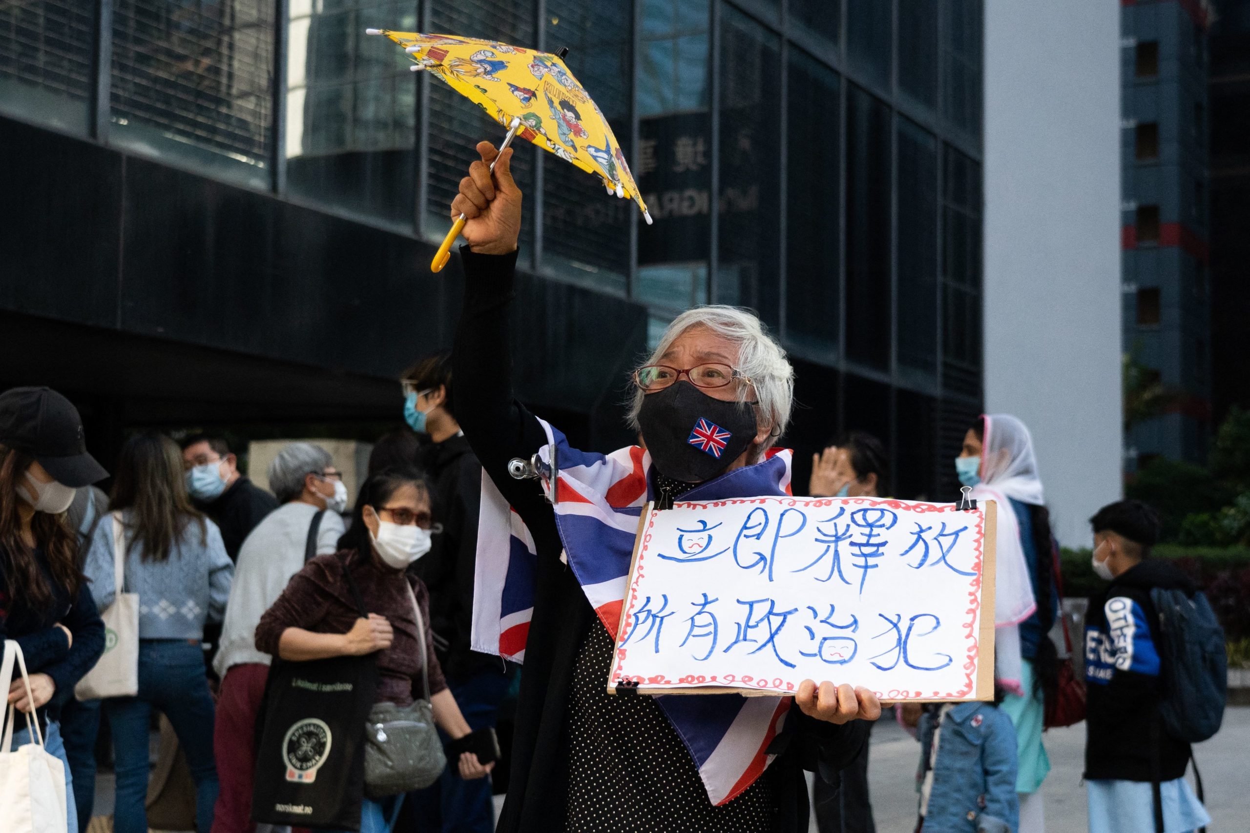 Pro-democracy activist Alexandra Wong, also known as Grandma Wong, gestures outside the Wanchai district court in Hong Kong on December 9, 2021, where jailed media mogul Jimmy Lai was among three democracy campaigners convicted for taking part in a banned Tiananmen vigil as the prosecution of multiple activists came to a conclusion. (Photo by BERTHA WANG/AFP via Getty Images)
