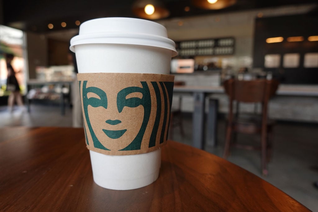 MIAMI, FLORIDA - JUNE 11: A Starbucks coffee cup sits on a table as the company reported supply shortages at some coffee shops on June 11, 2021 in Miami, Florida. The coffee chain said it had supply shortages for some items due to problems in the supply chain. (Photo by Joe Raedle/Getty Images)