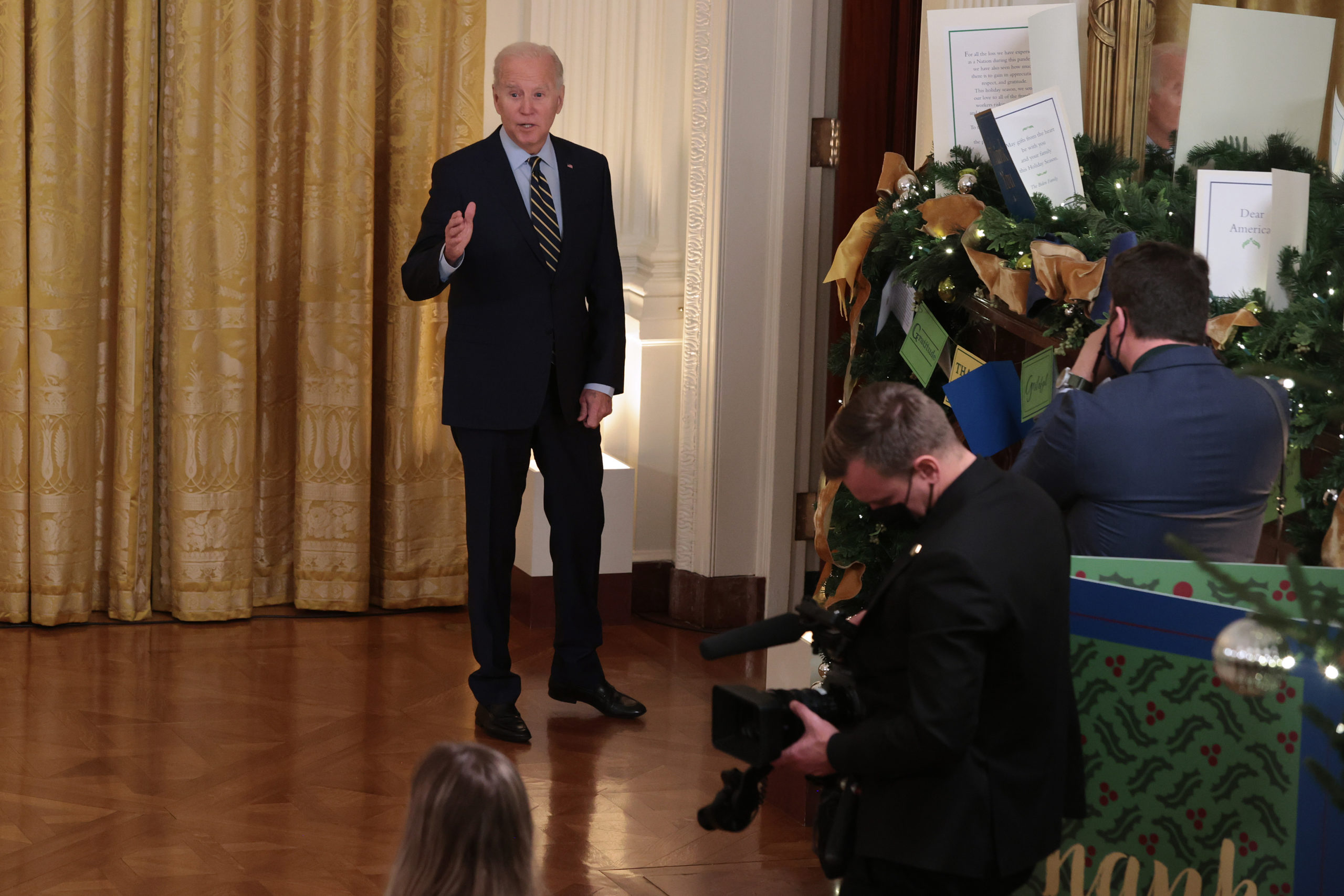 WASHINGTON, DC - DECEMBER 06: U.S. President Joe Biden pauses to answer a question before leaving the East Room after talking about the Build Back Better legislation's new rules around prescription drug prices at the White House on December 06, 2021 in Washington, DC. According to the White House, the legislation will lower the costs of prescription drugs by giving negotiation powers to Medicare, imposing a tax penalty if drug companies increase prices faster than inflation, lowering insulin prices to $35 a month for people with diabetes and other regulations. (Photo by Chip Somodevilla/Getty Images)