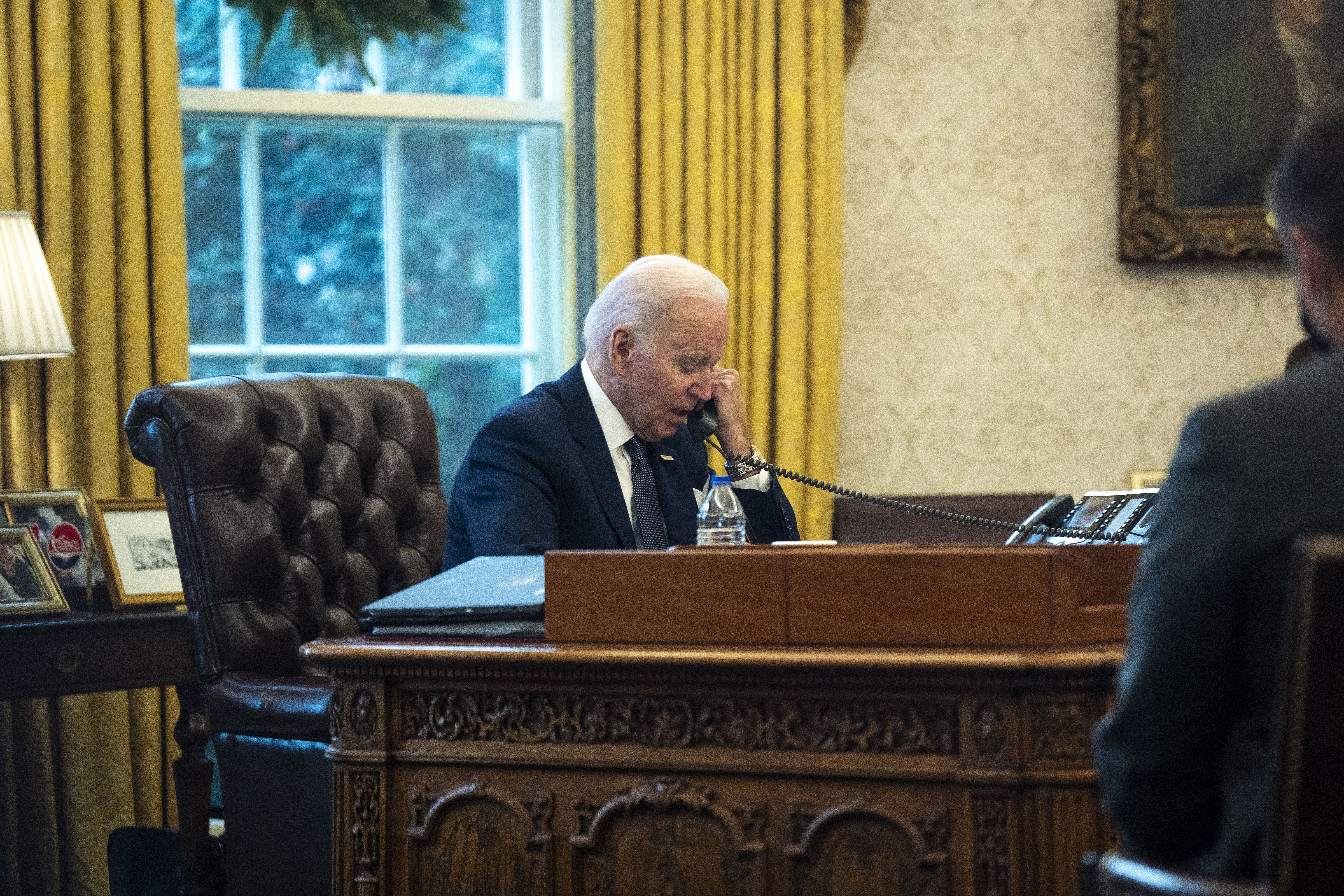 WASHINGTON, DC - DECEMBER 09: U.S. President Joe Biden talks on the phone with Ukrainian President Volodymyr Zelensky from the Oval Office at the White House on December 09, 2021 in Washington, DC. According to the White House, Biden and Zelensky discussed Russia’s military build-up on Ukraine’s borders. (Photo by Doug Mills-Pool/Getty Images)
