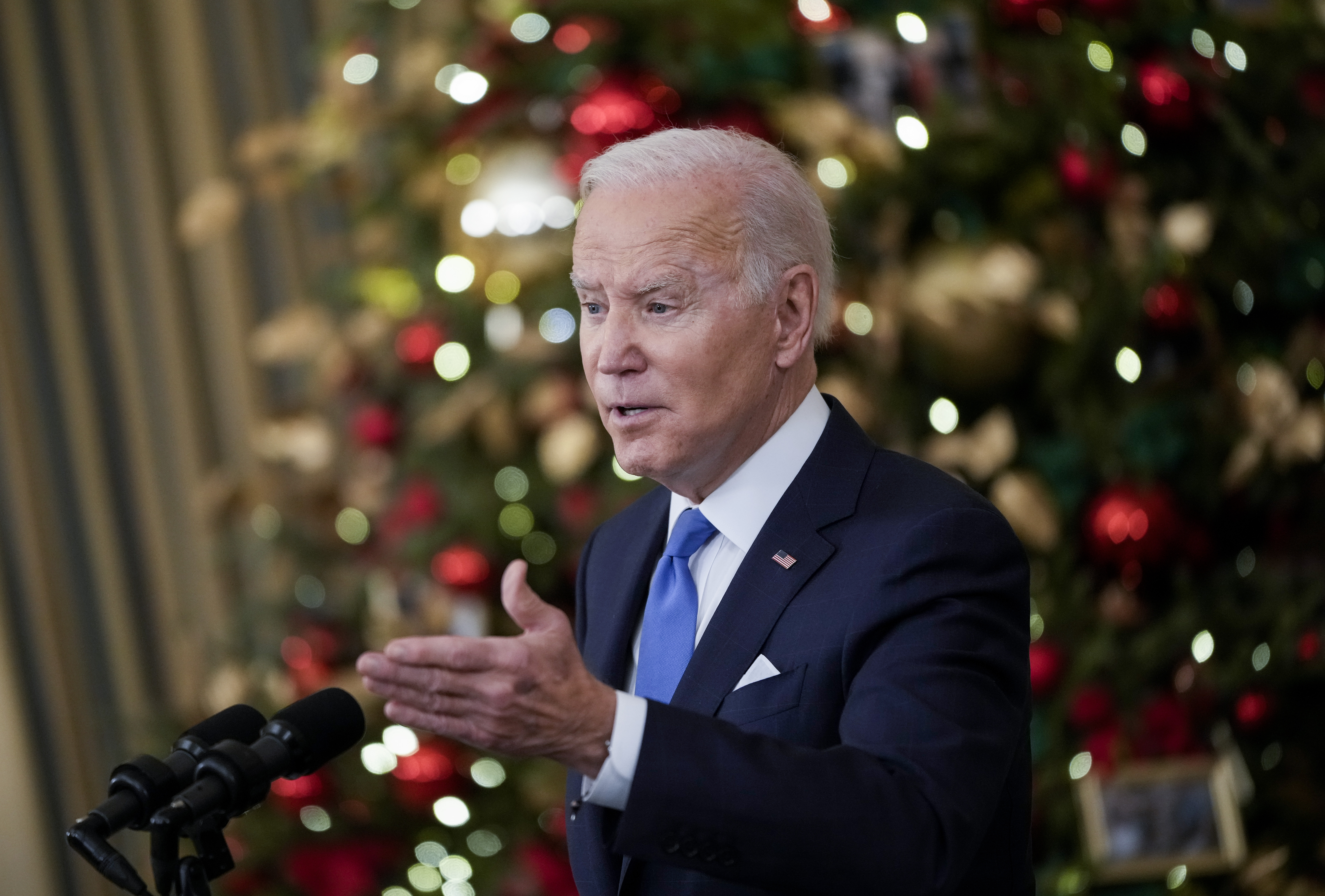 WASHINGTON, DC - DECEMBER 21: U.S. President Joe Biden speaks about the omicron variant of the coronavirus in the State Dining Room of the White House, December 21, 2021 in Washington, DC. As the omicron variant fuels a new wave of COVID-19 infections, Biden announced plans that will expand testing sites across the country, distribute millions of free at-home tests and boost federal resources to hospitals in need. (Photo by Drew Angerer/Getty Images)