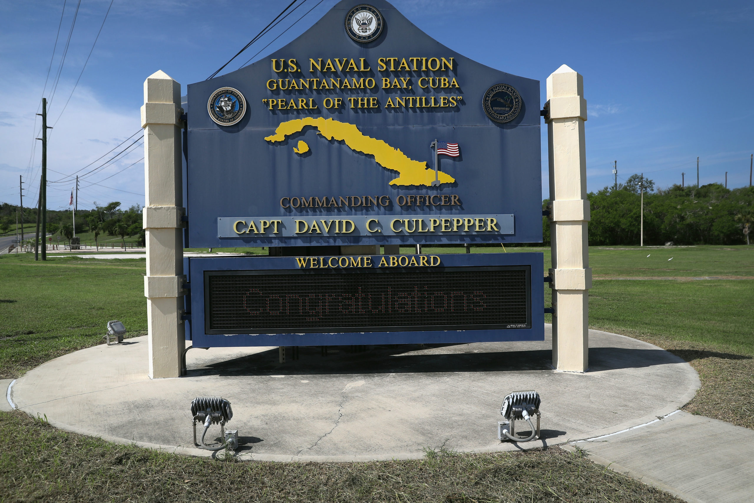 GUANTANAMO BAY, CUBA - OCTOBER 23: (EDITORS NOTE: Image has been reviewed by the U.S. Military prior to transmission.) A sign welcomes military personnel to the U.S. Naval Station at Guantanamo Bay, also known as Gitmo on October 23, 2016 at Guantanamo Bay, Cuba. The U.S. military's Joint Task Force Guantanamo is holding 60 detainees at the U.S. prison, located on the naval base, down from a previous total of 780. In 2008 President Obama issued an executive order to close the prison, which has failed because of political opposition in the U.S. (Photo by John Moore/Getty Images)