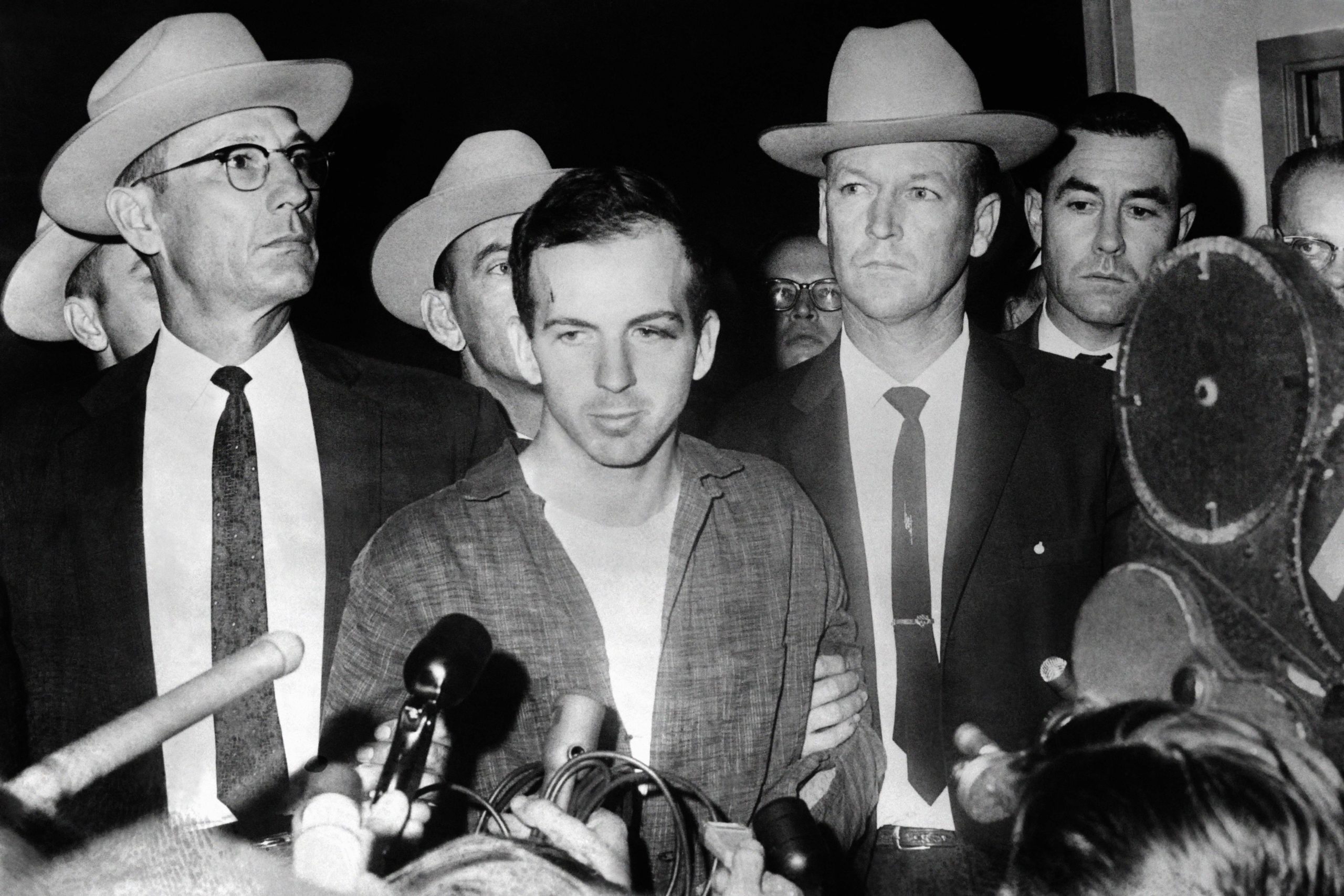 Picture dated 22 November 1963 of US President John F. Kennedy's murderer Lee Harvey Oswald during a press conference after his arrest in Dallas. Lee Harvey Oswald was killed by Jack Ruby on 24 November on the eve of Kennedy's burial. AFP PHOTO (Photo by STRINGER / AFP) (Photo credit should read STRINGER/AFP via Getty Images)