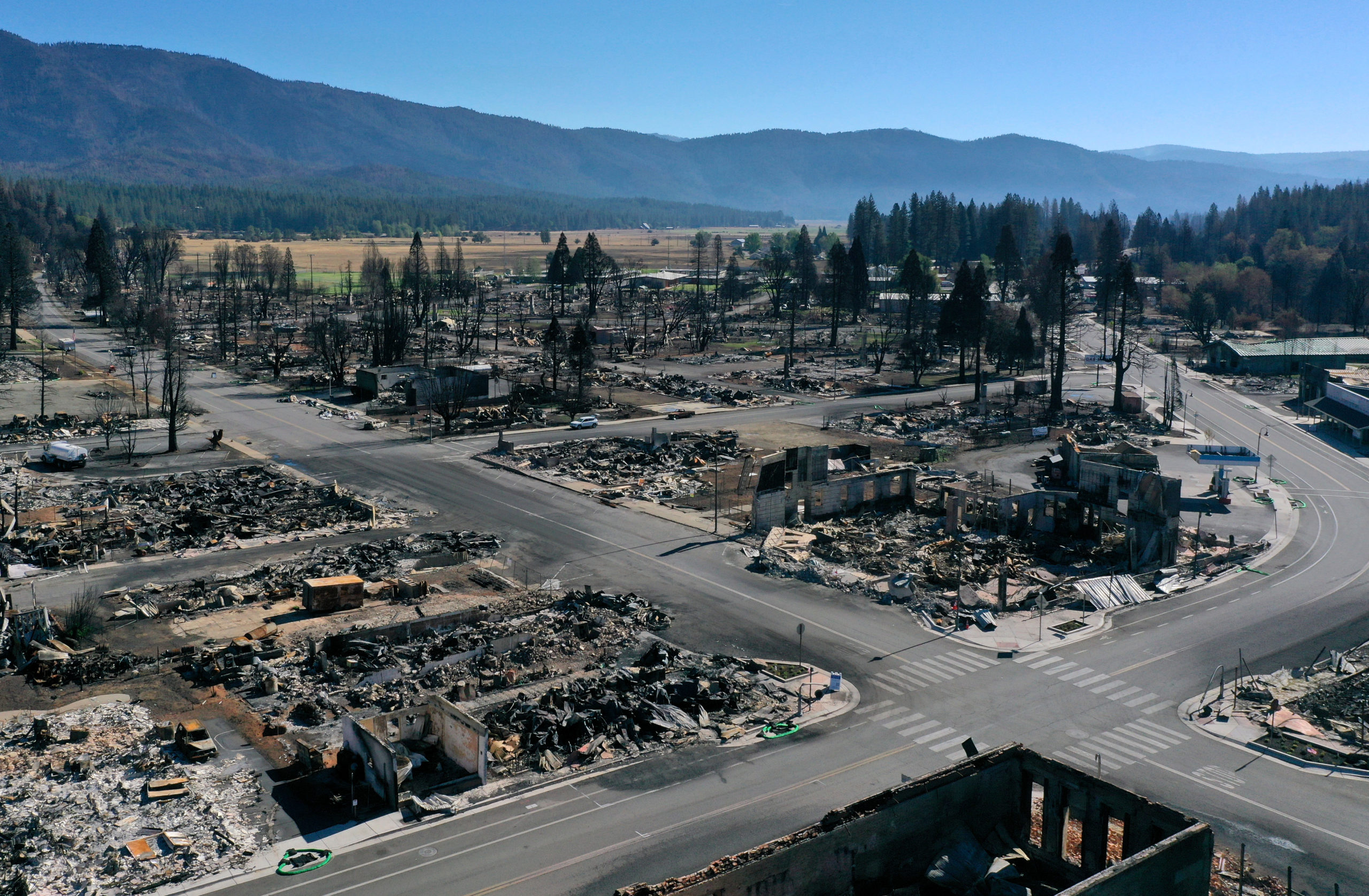 In an aerial view, the remains of homes and businesses that were destroyed by the Dixie Fire are visible on September 24, 2021 in Greenville, California. (Photo by Justin Sullivan/Getty Images)