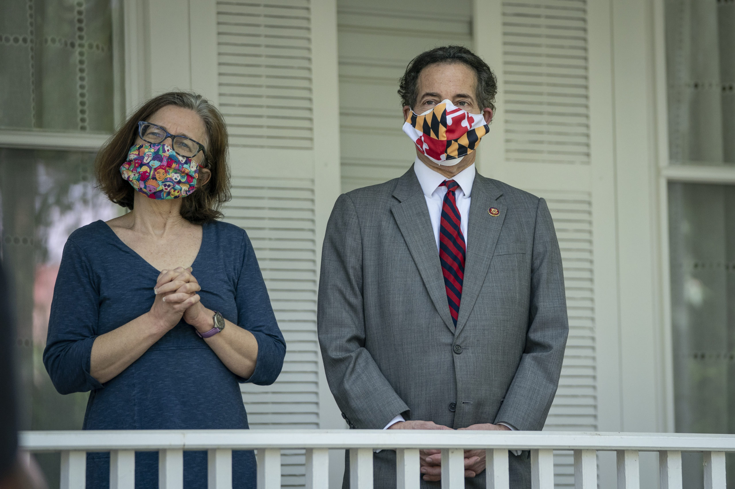 TAKOMA PARK, MD - MAY 04: (L-R) Sarah Bloom Raskin and U.S. Rep. Jamie Raskin (D-MD) listen as a group of Maryland residents, calling themselves the 'Pandemic Comforters,' sing in the front yard of his home on May 4, 2020 in Takoma Park, Maryland. The singers wanted to use the nice weather to show gratitude to Rep. Raskin for his work in Congress and offer their prayers during the coronavirus pandemic. Last week, Rep. Raskin was appointed by Speaker of the House Nancy Pelosi to the newly created House Select Committee On Coronavirus. (Photo by Drew Angerer/Getty Images)