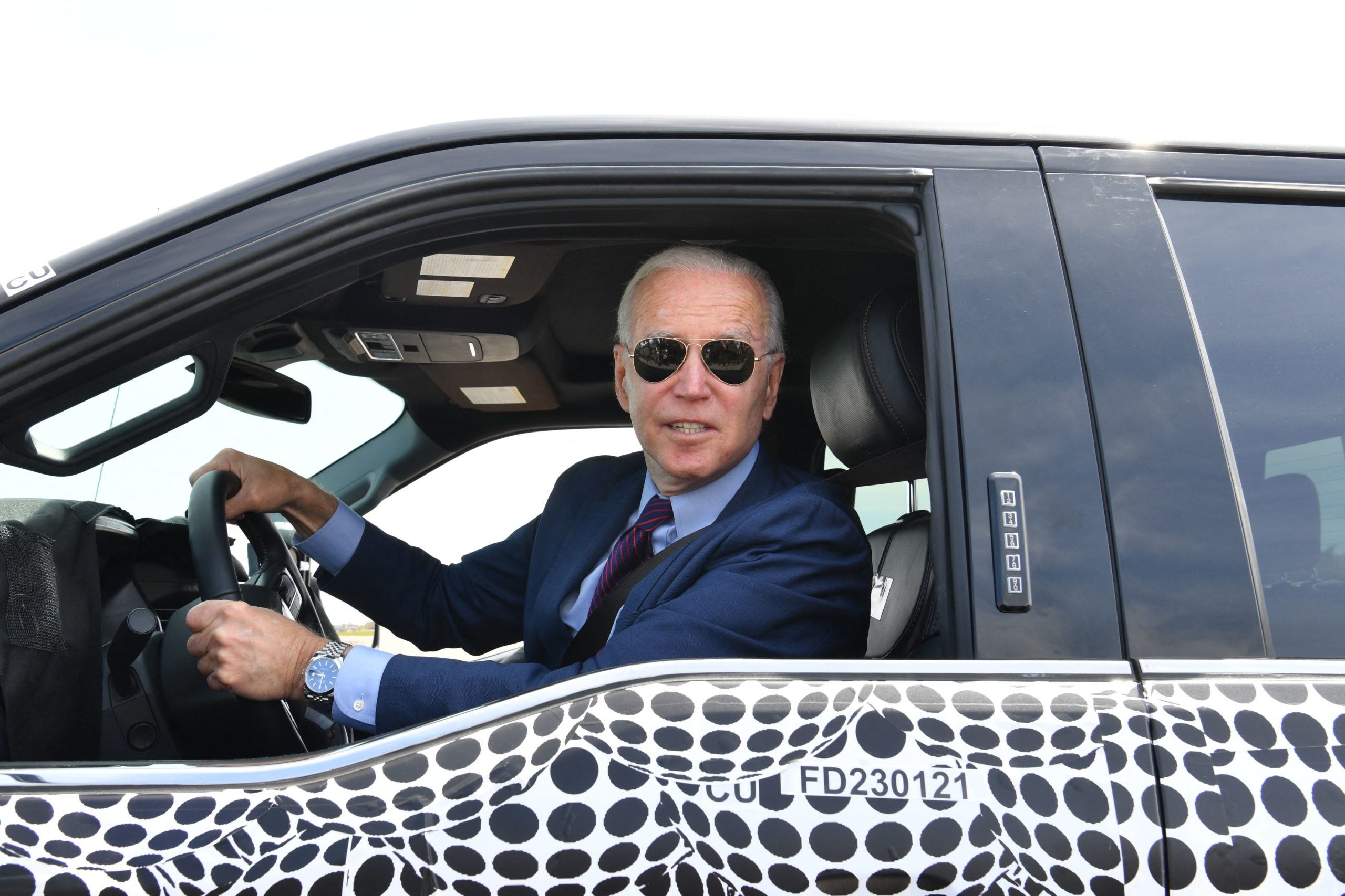 President Joe Biden drives a Ford F-150 Lightning at the Ford Dearborn Development Center in Dearborn, Michigan on May 18. (Nicholas Kamm/AFP via Getty Images)