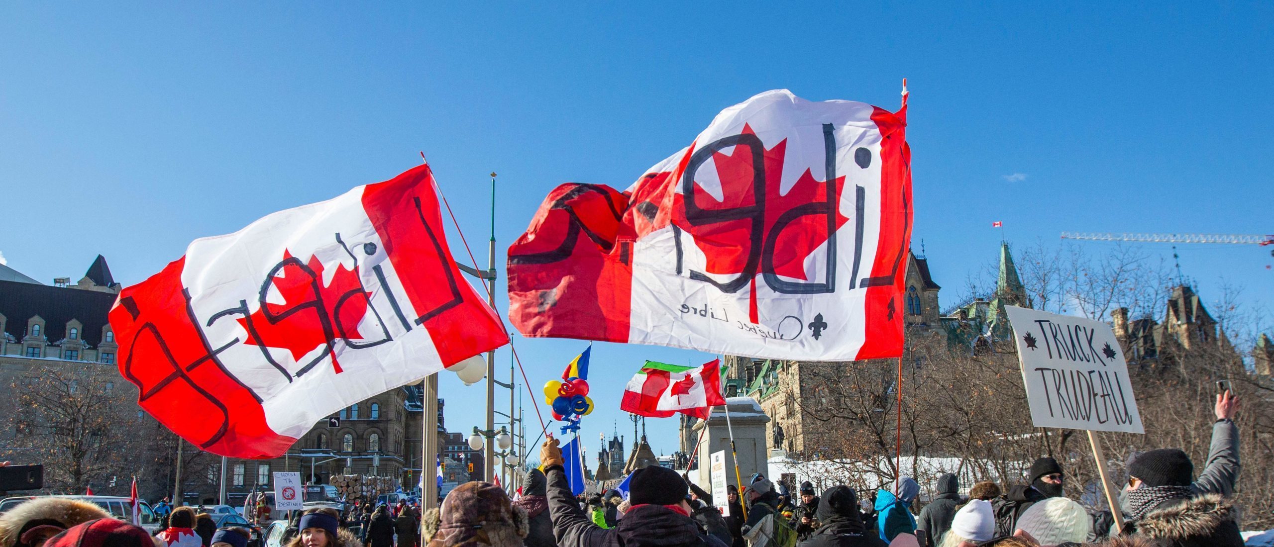 Supporters of the Freedom Convoy protest Covid-19 vaccine mandates and restrictions in front of Parliament on January 29, 2022 in Ottawa, Canada. (Photo by Lars Hagberg / AFP) (Photo by LARS HAGBERG/AFP via Getty Images)