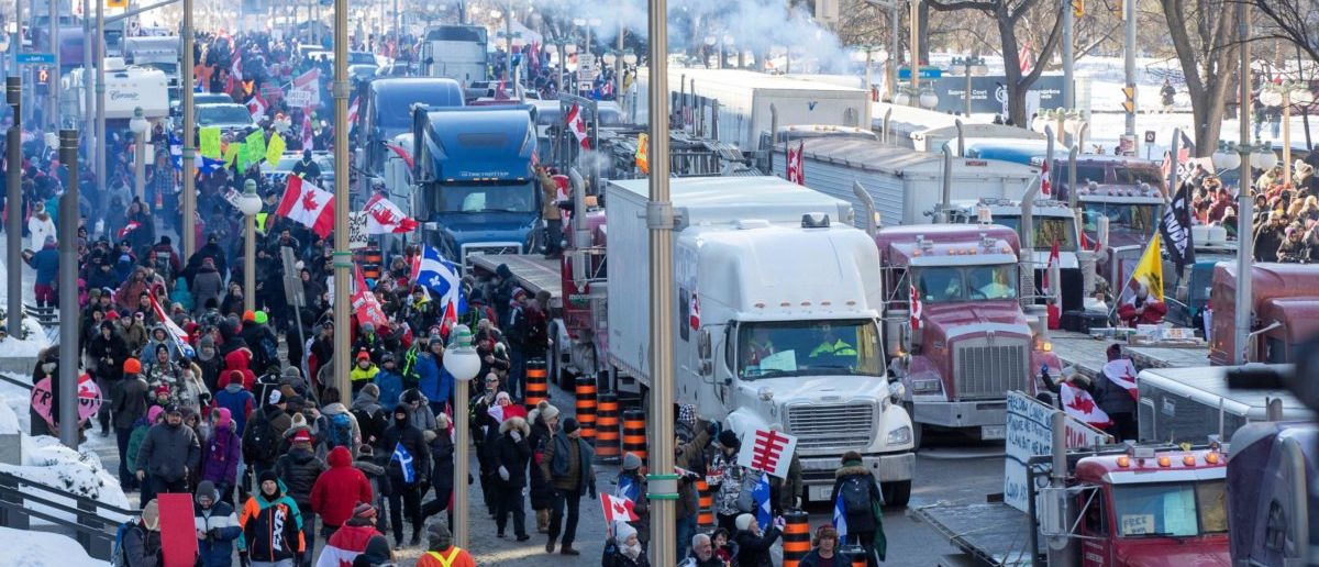 Supporters arrive at Parliament Hill for the Freedom Truck Convoy to protest against Covid-19 vaccine mandates and restrictions in Ottawa, Canada, on January 29, 2022. - Hundreds of truckers drove their giant rigs into the Canadian capital Ottawa on Saturday as part of a self-titled "Freedom Convoy" to protest vaccine mandates required to cross the US border. LARS HAGBERG/AFP via Getty Images