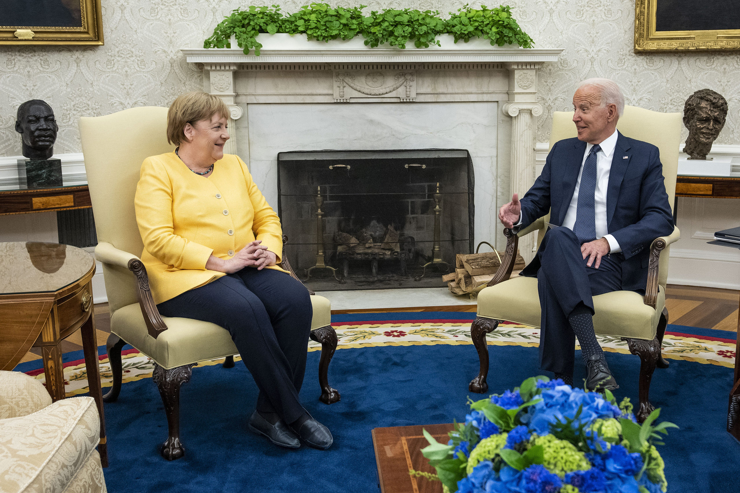 Former German Chancellor Angela Merkel and President Joe Biden make brief remarks to the press before a meeting on July 15. (Doug Mills/Pool/Getty Images)