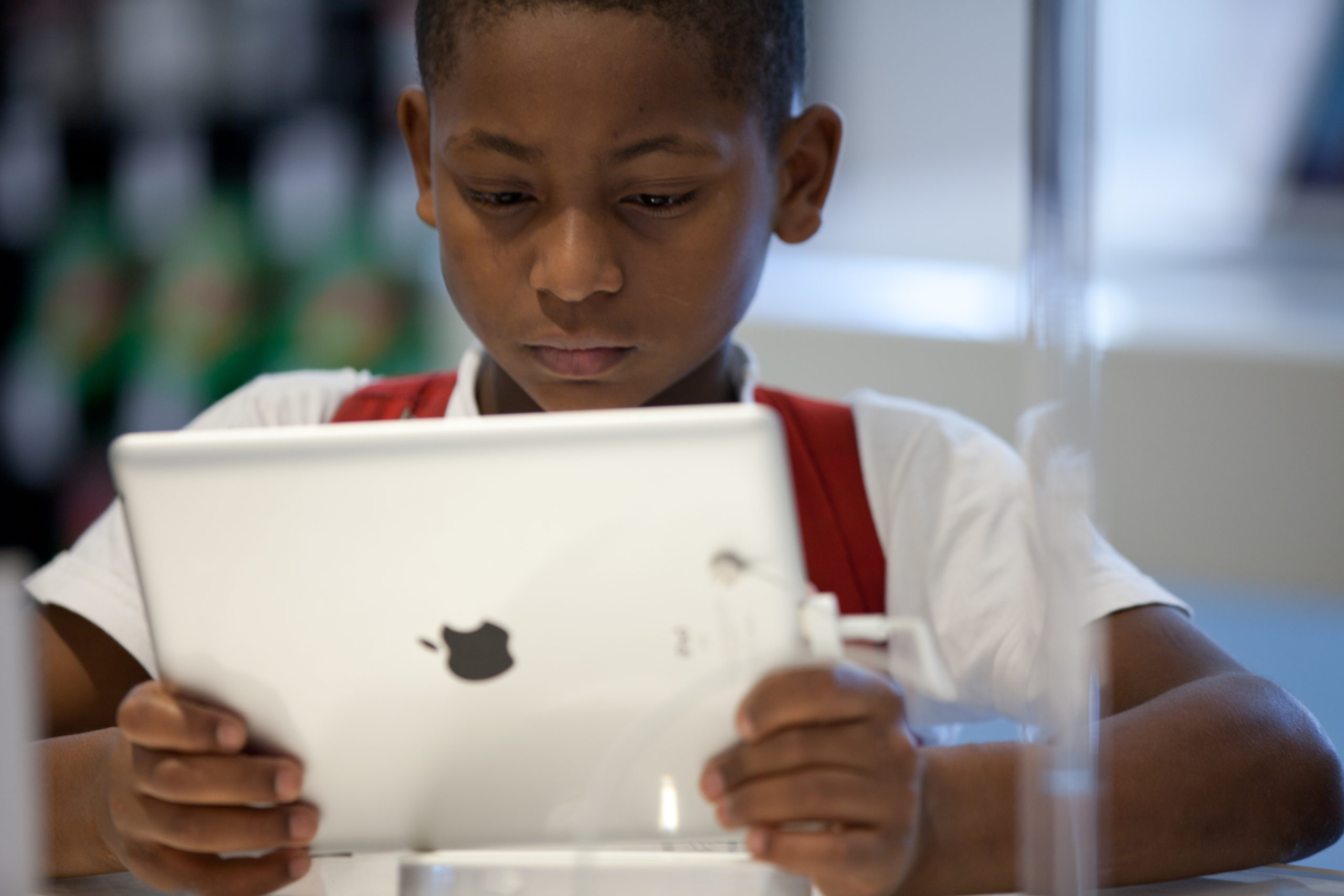 A Brazilian boy looks at an ipad at the retail shop of Apple products in Sao Paulo. Steve Jobs, co-founder and former CEO of Apple Inc, died on October 5, 2011 from cancer at 56. Jobs co-founded Apple in 1976 and is credited with marketing the world's first personal computer in addition to the popular iPod, iPhone and iPad. AFP PHOTO/YASUYOSHI CHIBA (Photo credit should read YASUYOSHI CHIBA/AFP via Getty Images)