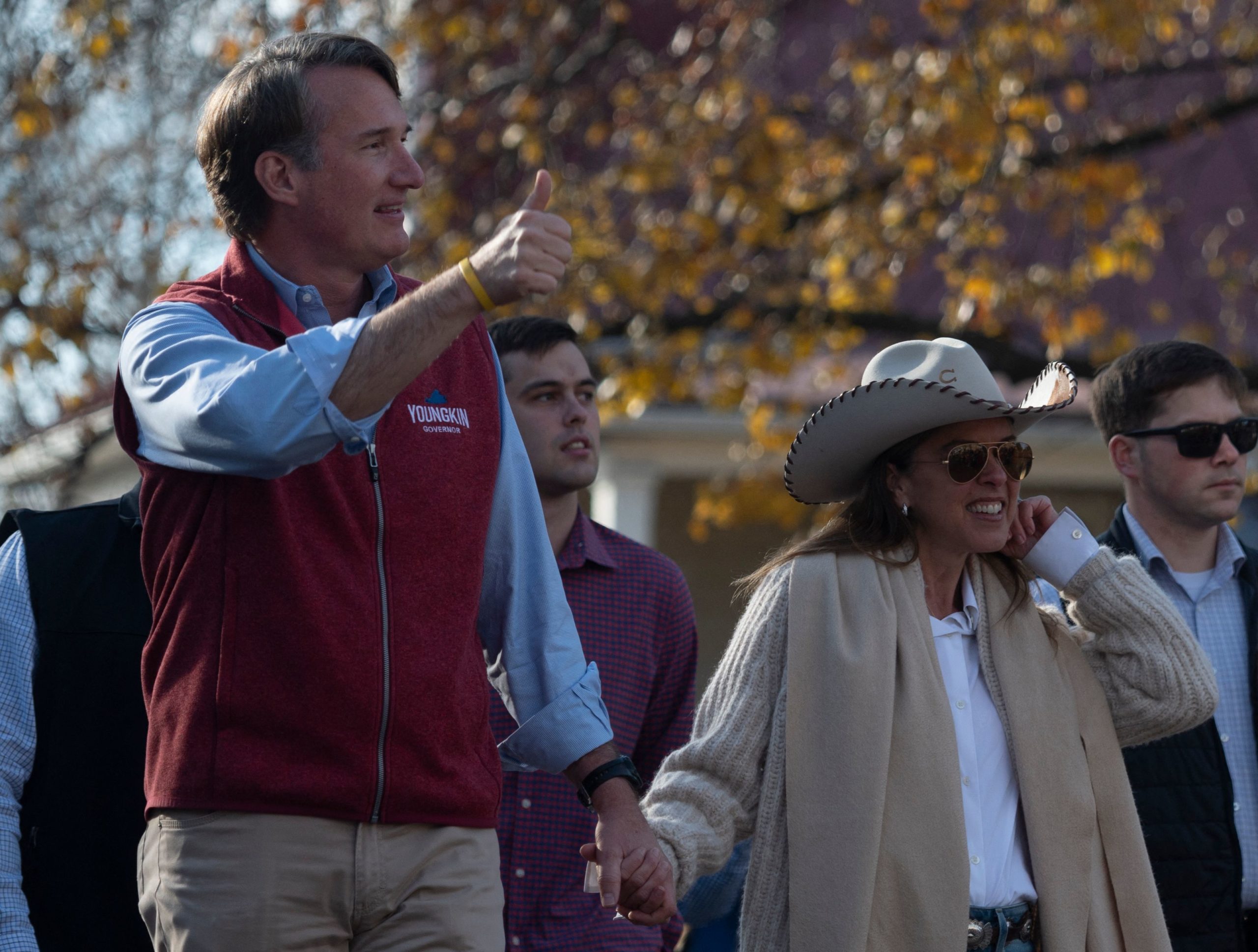 Virginia Governor elect, Glenn Youngkin (L), and his wife Suzanne Youngkin, attend the Christmas parade in Middleburg, Virginia on December 4, 2021. (Photo by ANDREW CABALLERO-REYNOLDS/AFP via Getty Images)
