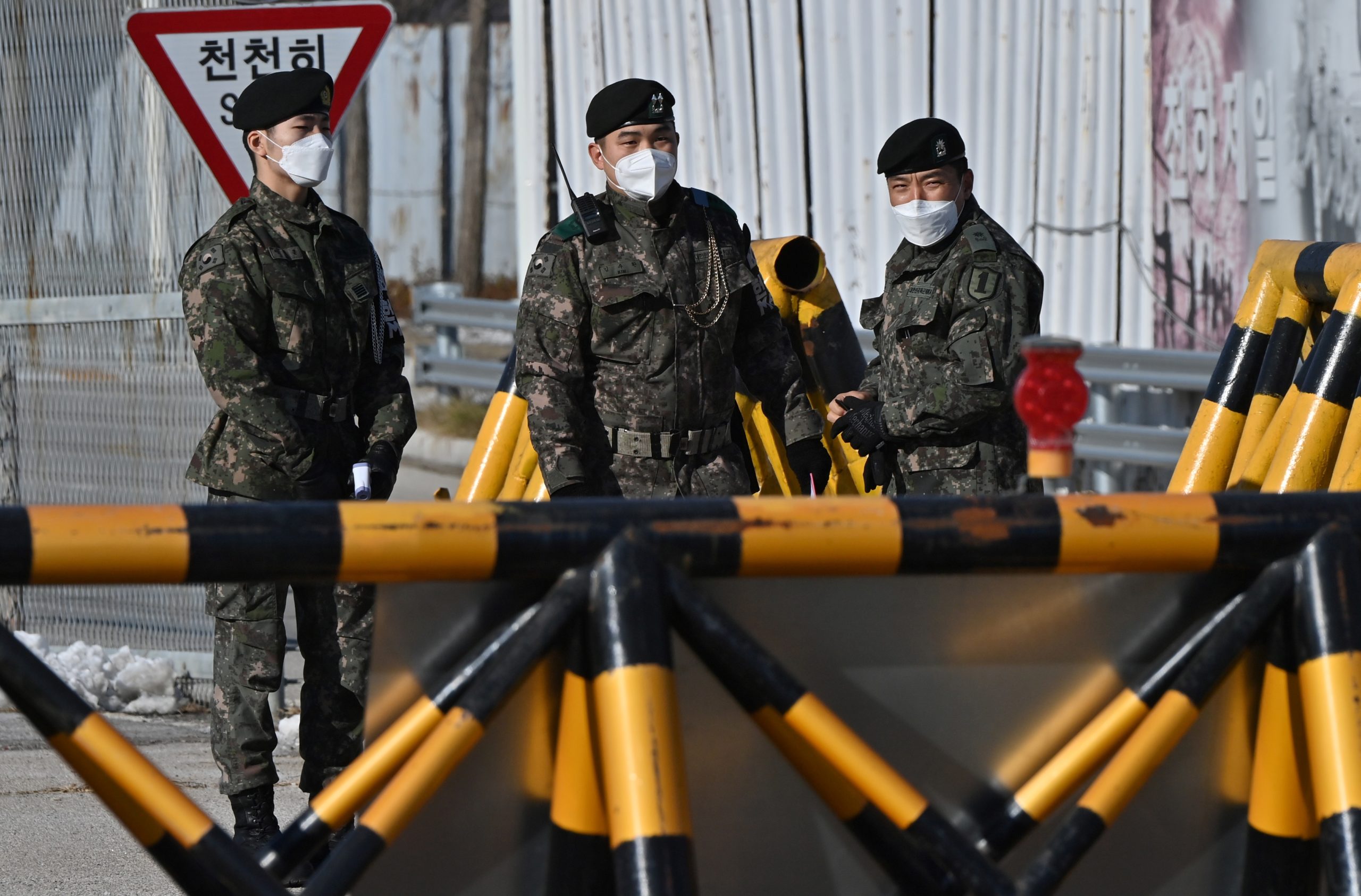 South Korean soldiers stand at a checkpoint on the Tongil bridge, the road leading to North Korea's Kaesong joint industrial complex, near the Demilitarized Zone (DMZ) dividing the two Koreas in Paju on December 15, 2020, a day after South Korea's parliament passed a law criminalising sending anti-Pyongyang leaflets into the North. (Photo by Jung Yeon-je / AFP) (Photo by JUNG YEON-JE/AFP via Getty Images)