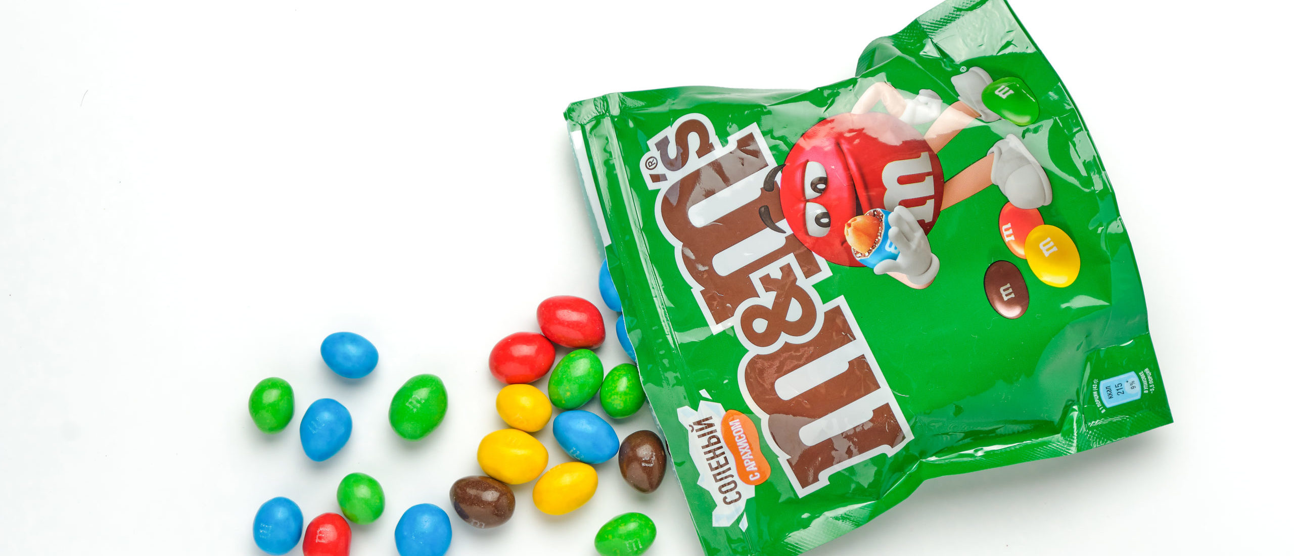 green M&M's character swaps iconic go-go boots for sneakers in