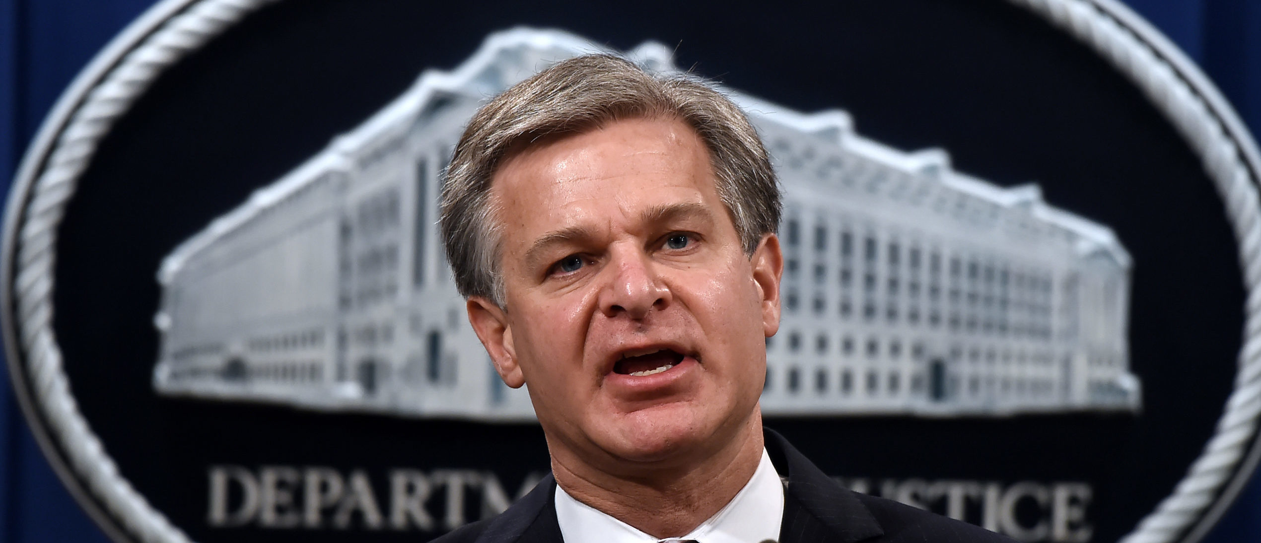 Federal Bureau of Investigation Director Christopher Wray announces significant law enforcement actions related to the illegal sale of drugs and other illicit goods and services on the Darknet during a press conference at the Department of Justice September 22, 2020 in Washington, DC. (Photo by Olivier DOULIERY / POOL / AFP) (Photo by OLIVIER DOULIERY/POOL/AFP via Getty Images)