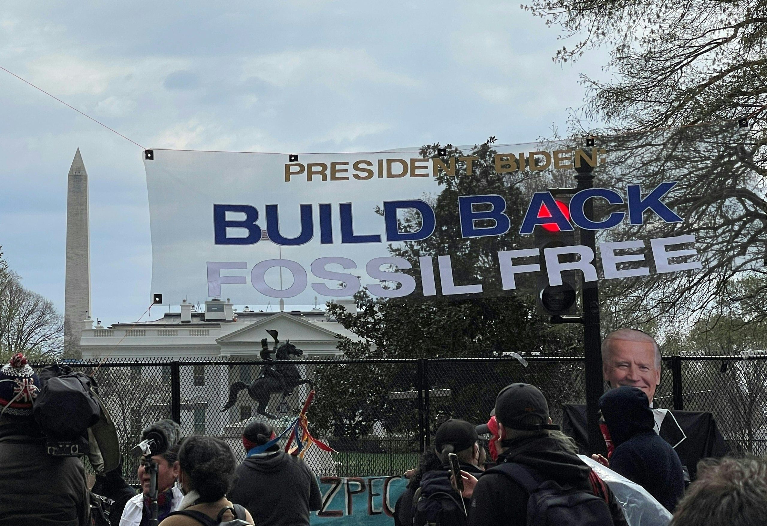 Activists display banners protesting existing pipelines on April 1, 2021, one block from the White House. (Daniel Slim/AFP via Getty Images)