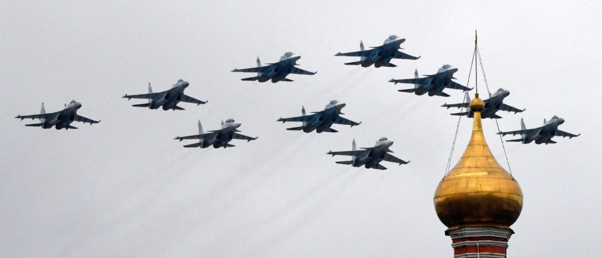 Russian Sukhoi Su-35S fighter aircrafts, Su-34 military fighter jets and Su-30SM jet fighters fly in formation over central Moscow during the Victory Day military parade on May 9, 2021. - Russia celebrates the 76th anniversary of the victory over Nazi Germany during World War II. (Photo by Alexander NEMENOV / AFP) (Photo by ALEXANDER NEMENOV/AFP via Getty Images)