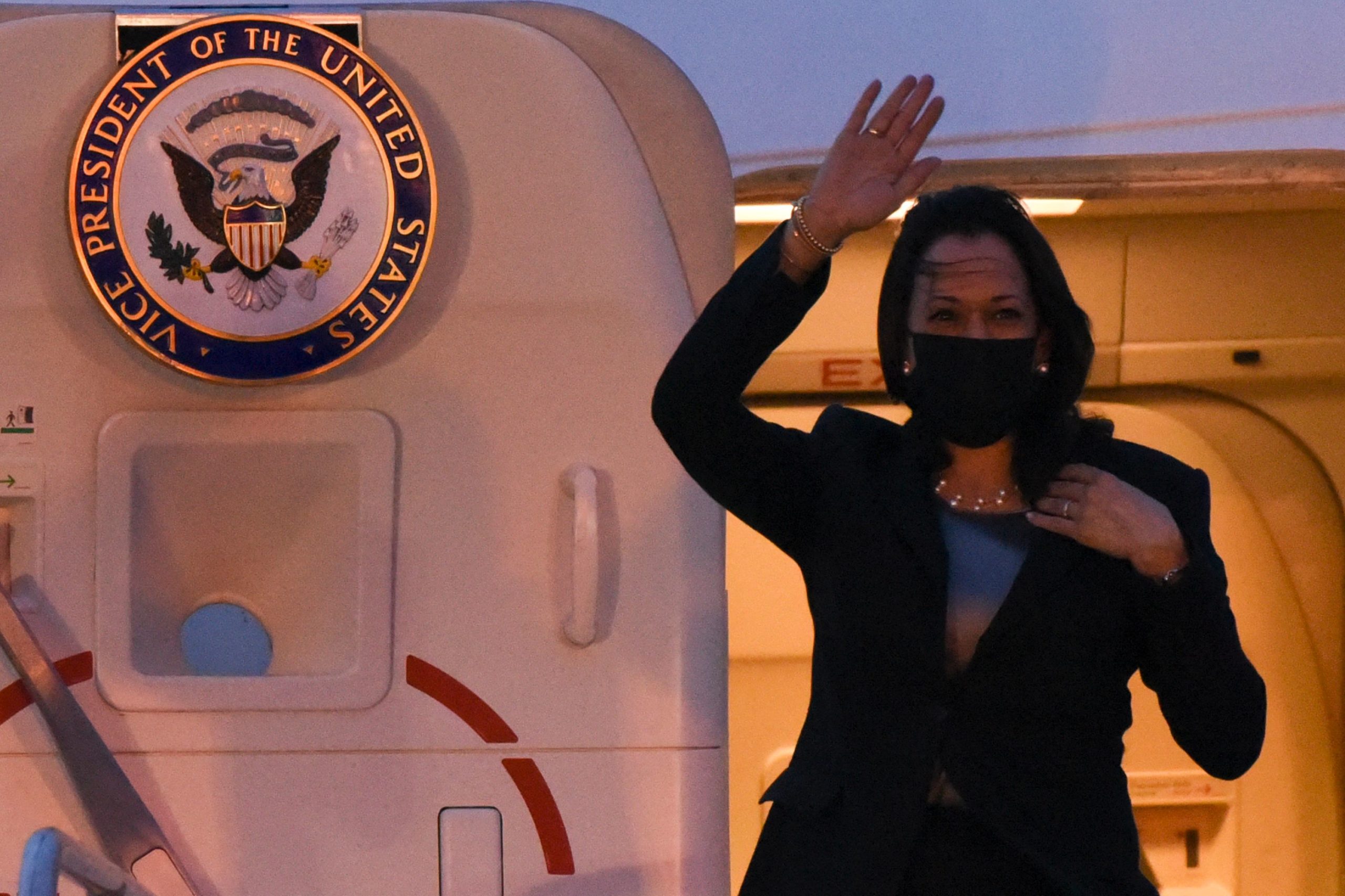 US Vice President Kamala Harris waves upon arrival at the Air Force Base in Guatemala City, on June 6, 2021. - The Vice-President of the United States, Kamala Harris, arrives in Guatemala this Sunday, on her first trip to Latin America, to address issues related to the growing migration to her country and the fight against corruption. (Photo by Orlando ESTRADA / AFP) (Photo by ORLANDO ESTRADA/AFP via Getty Images)